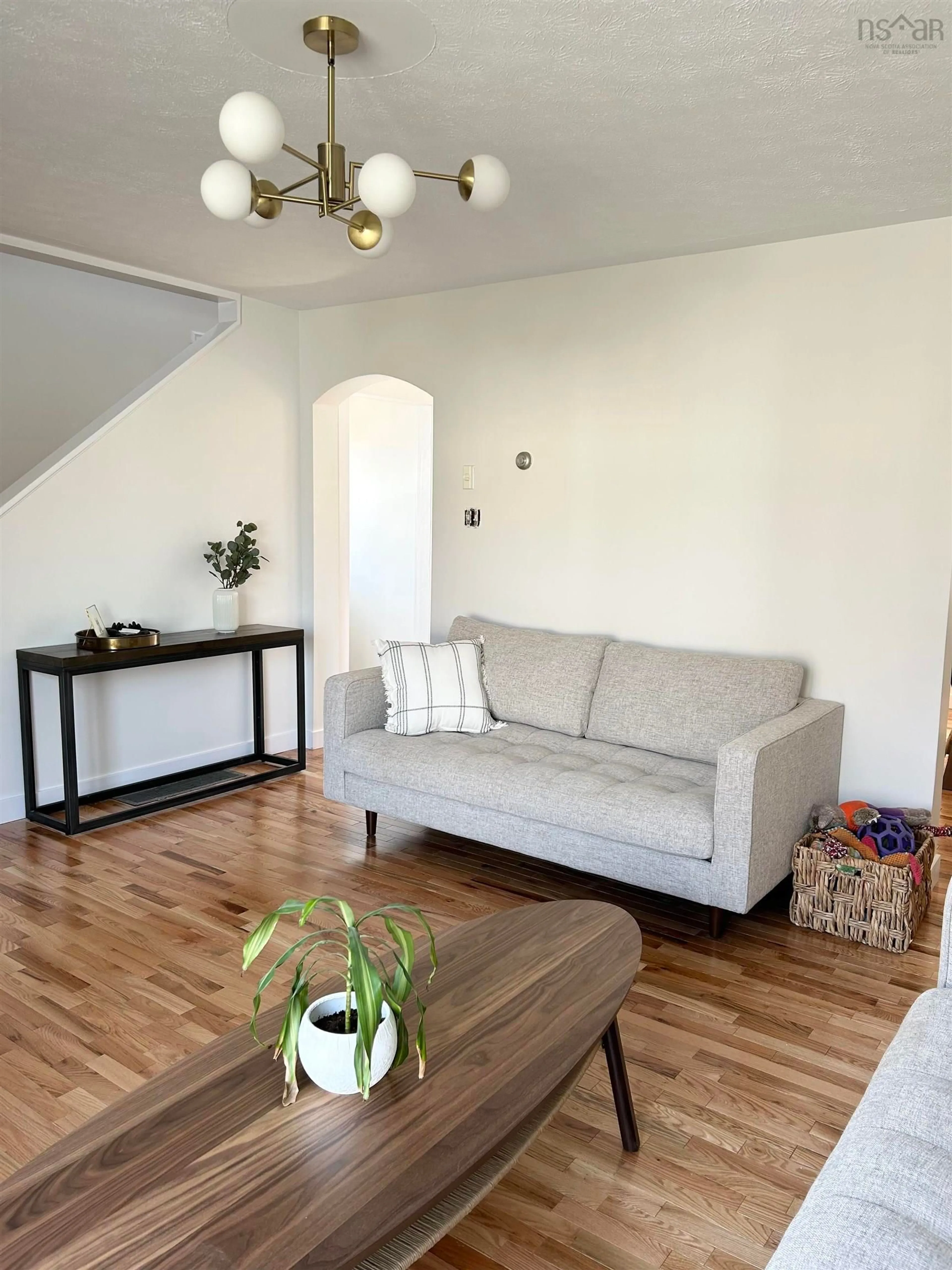 Living room with furniture, wood/laminate floor for 26 Lynnville Dr, Sackville Nova Scotia B4C 2H8