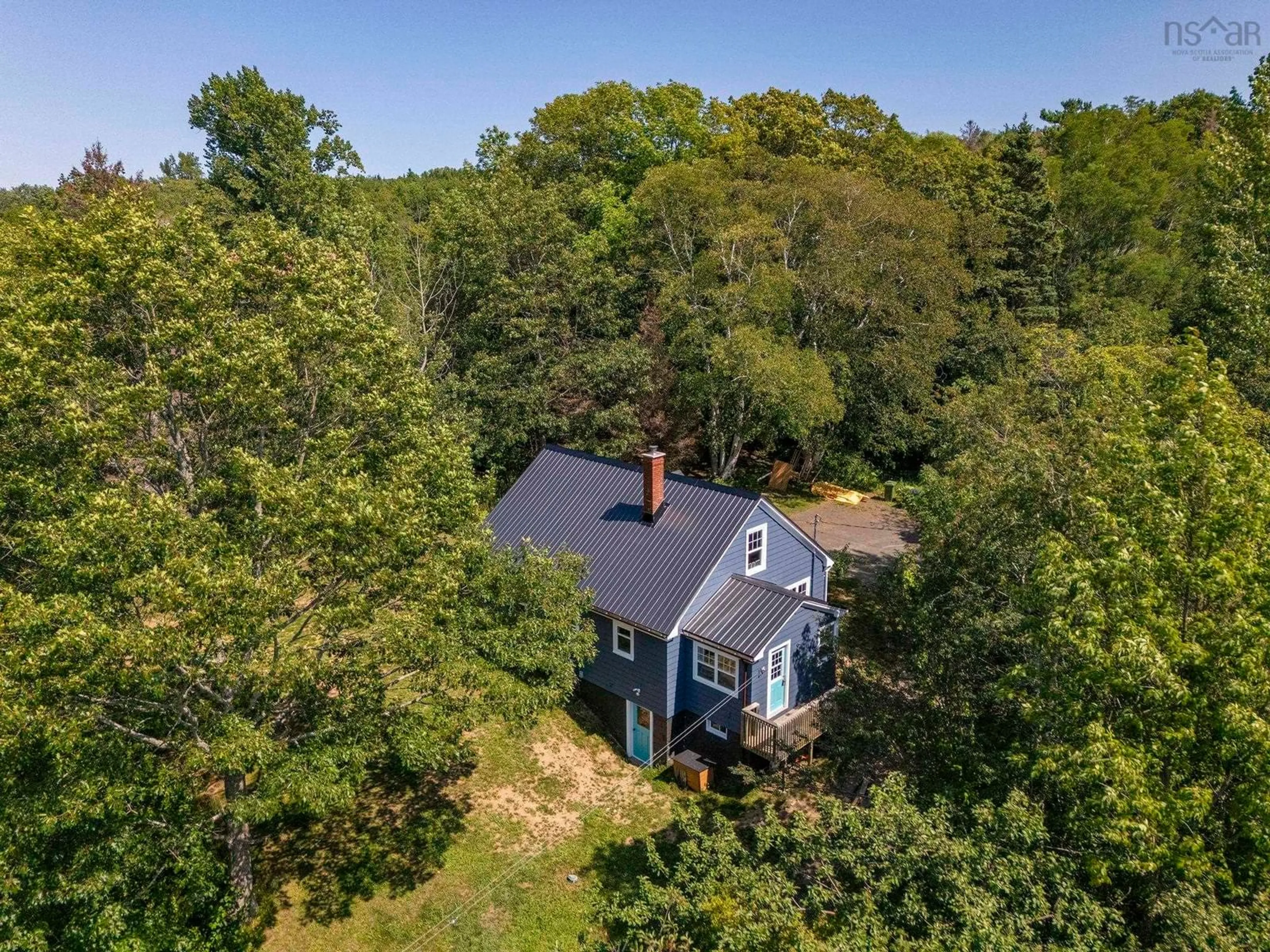 A pic from outside/outdoor area/front of a property/back of a property/a pic from drone, forest/trees view for 205 Highway 1, Deep Brook Nova Scotia B0S 1J0