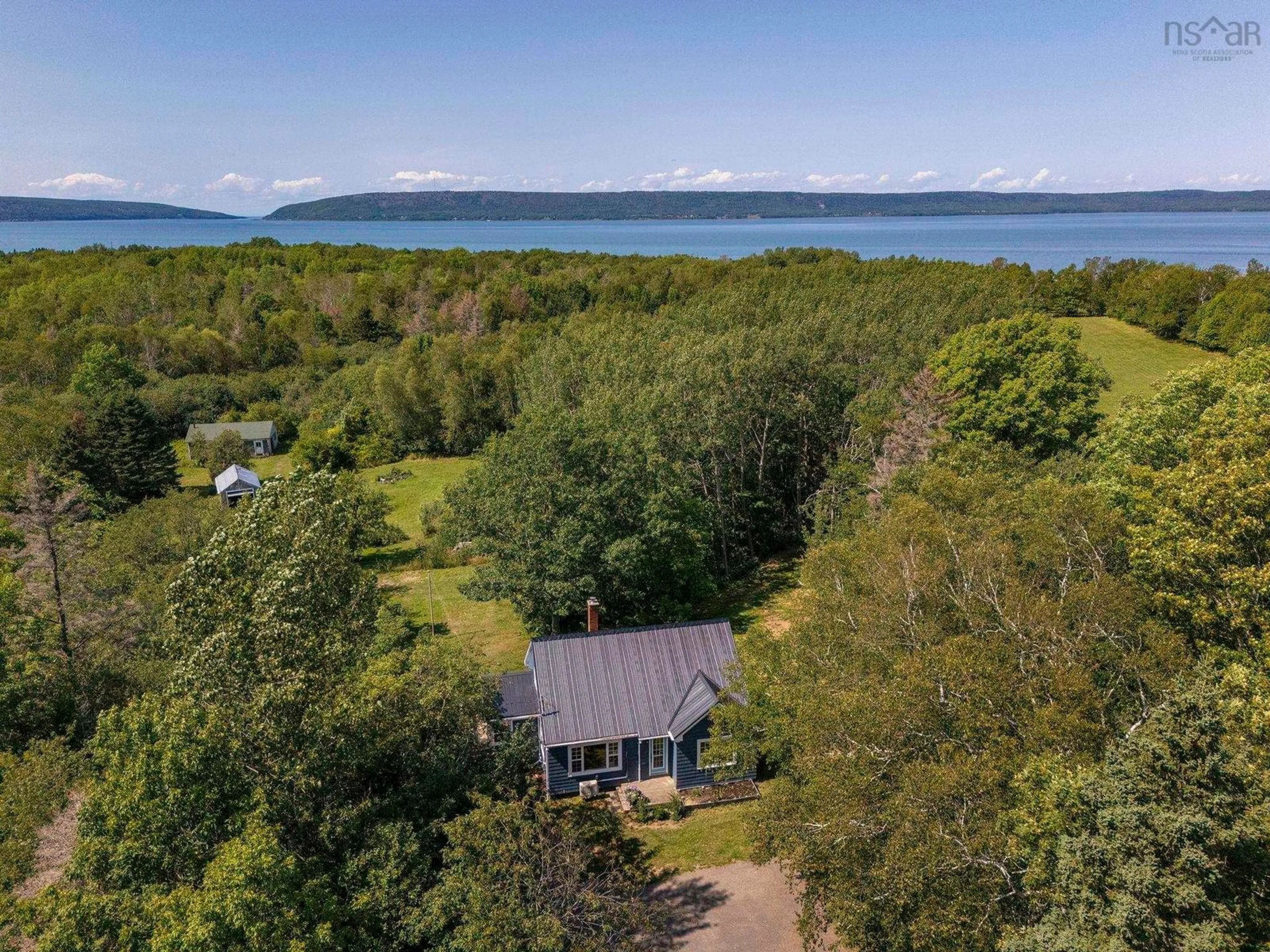 A pic from outside/outdoor area/front of a property/back of a property/a pic from drone, water/lake/river/ocean view for 205 Highway 1, Deep Brook Nova Scotia B0S 1J0