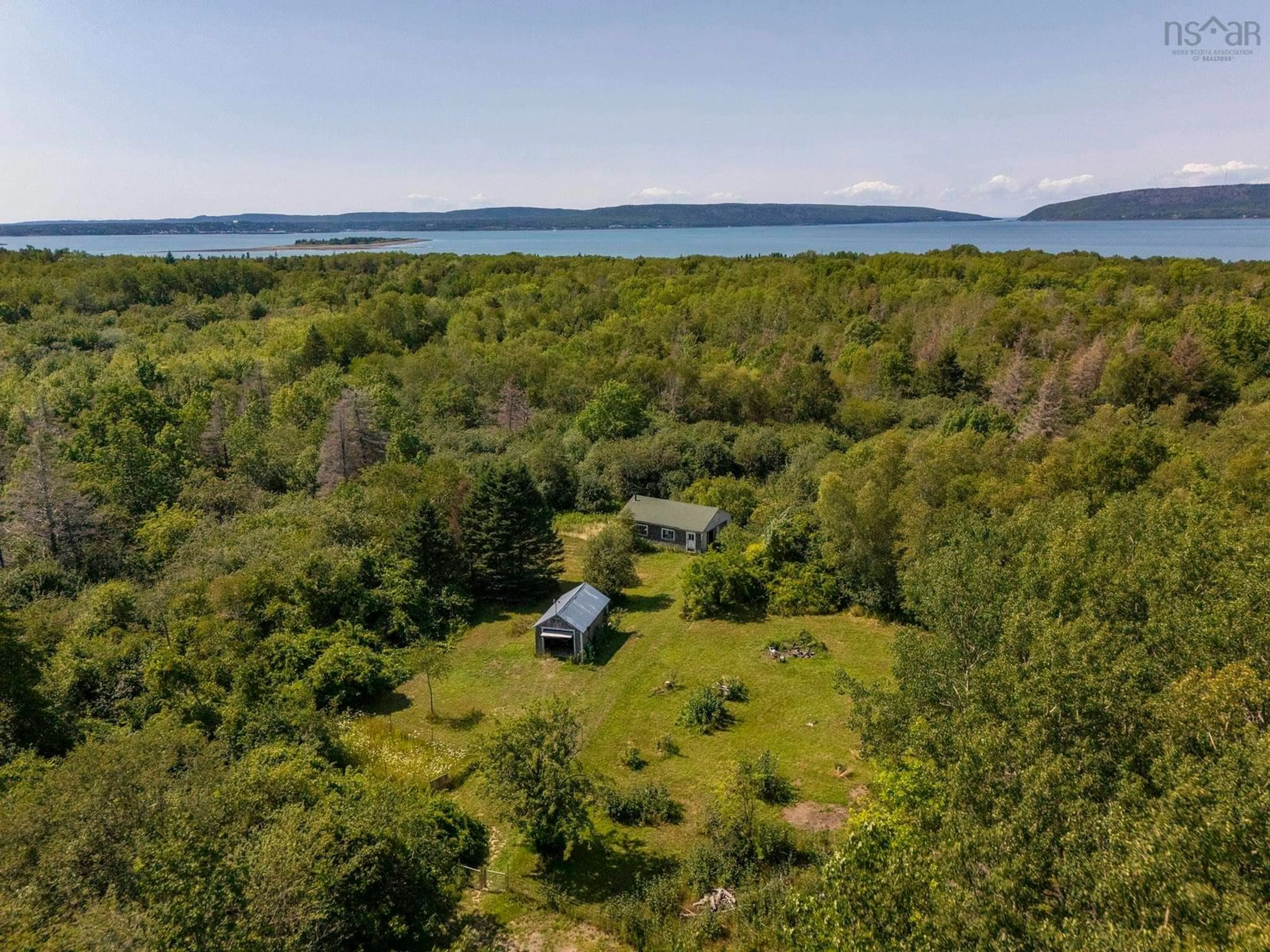 A pic from outside/outdoor area/front of a property/back of a property/a pic from drone, water/lake/river/ocean view for 205 Highway 1, Deep Brook Nova Scotia B0S 1J0