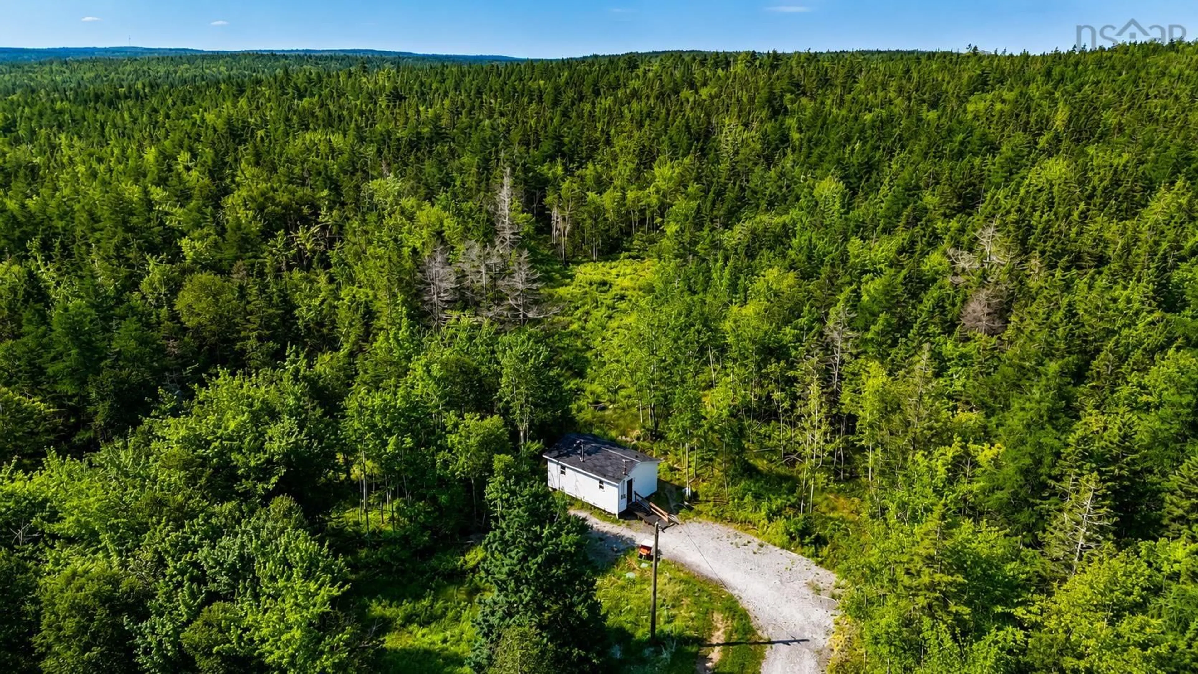 A pic from outside/outdoor area/front of a property/back of a property/a pic from drone, forest/trees view for 7064 West Bay Hwy, Cape George Nova Scotia B0E 3B0