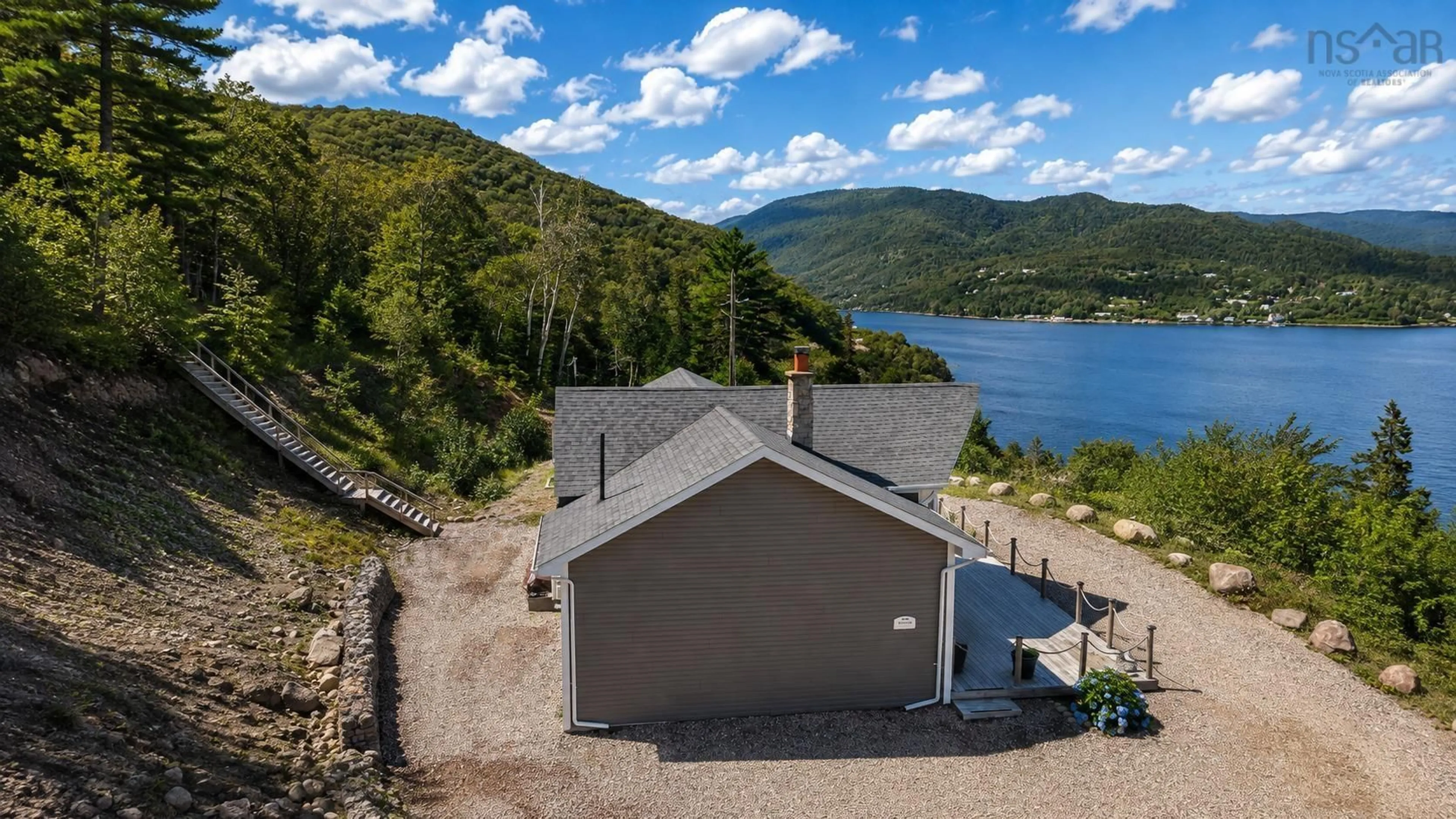 A pic from outside/outdoor area/front of a property/back of a property/a pic from drone, water/lake/river/ocean view for 39132 Cabot Trail, Ingonish Ferry Nova Scotia B0C 1L0