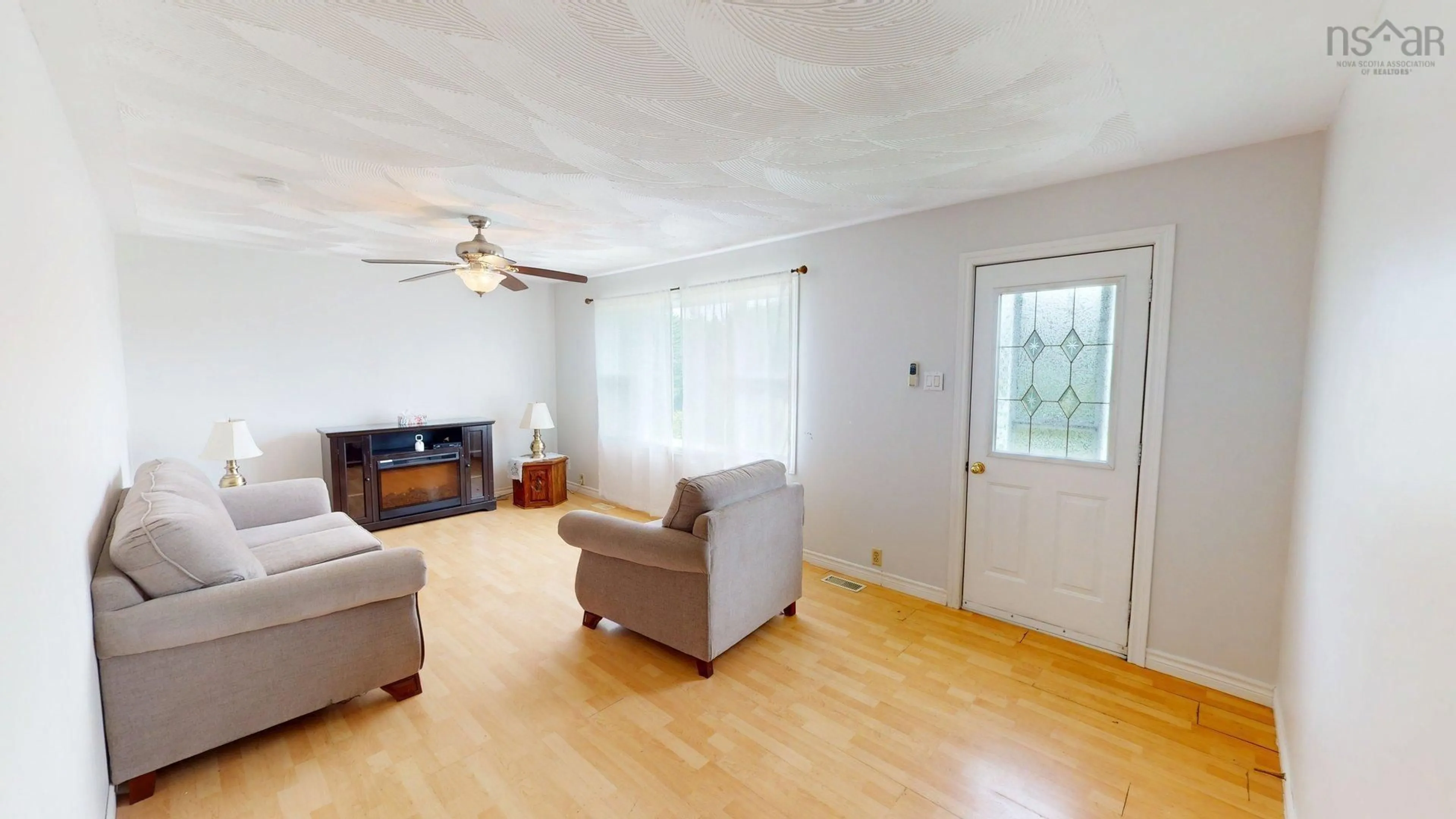Living room with furniture, wood/laminate floor for Meadow Brook Hill #79, Mulgrave Nova Scotia B0E 2G0