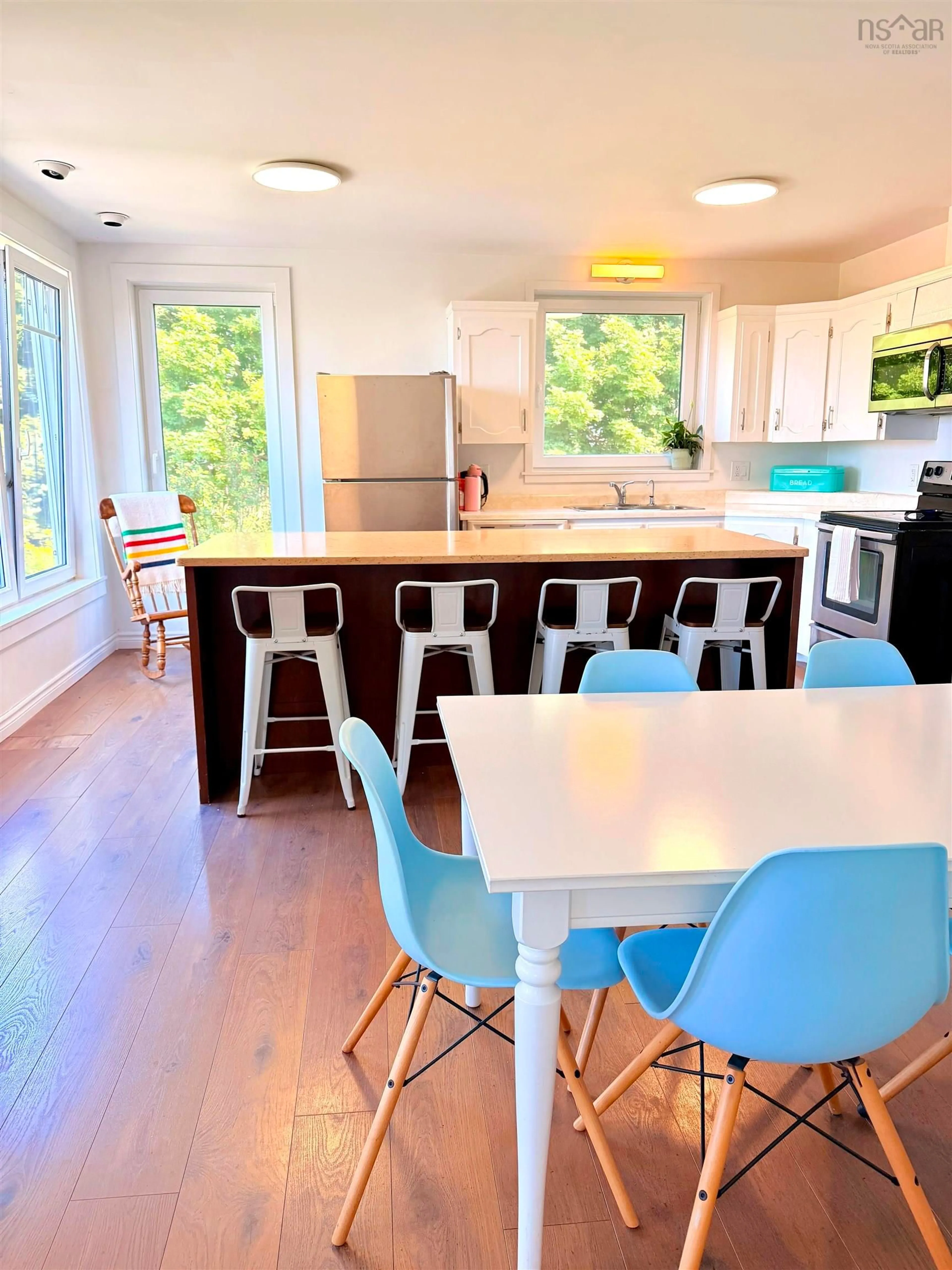 Open concept kitchen, wood/laminate floor for 15 Church St, Inverness Nova Scotia B0E 1N0