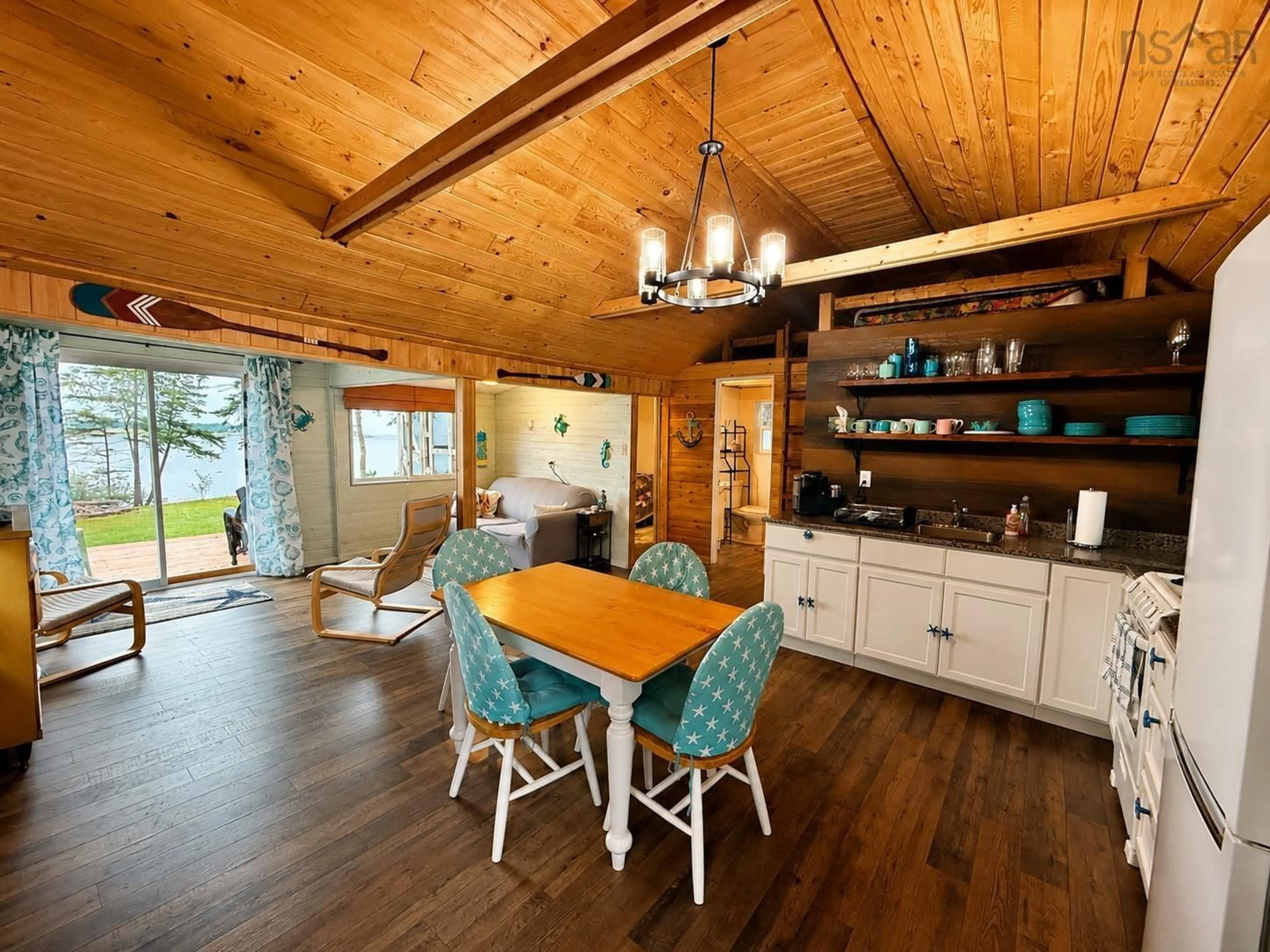 Open concept kitchen, wood/laminate floor for 29 River Lane, Port Philip Nova Scotia B0K 1L0