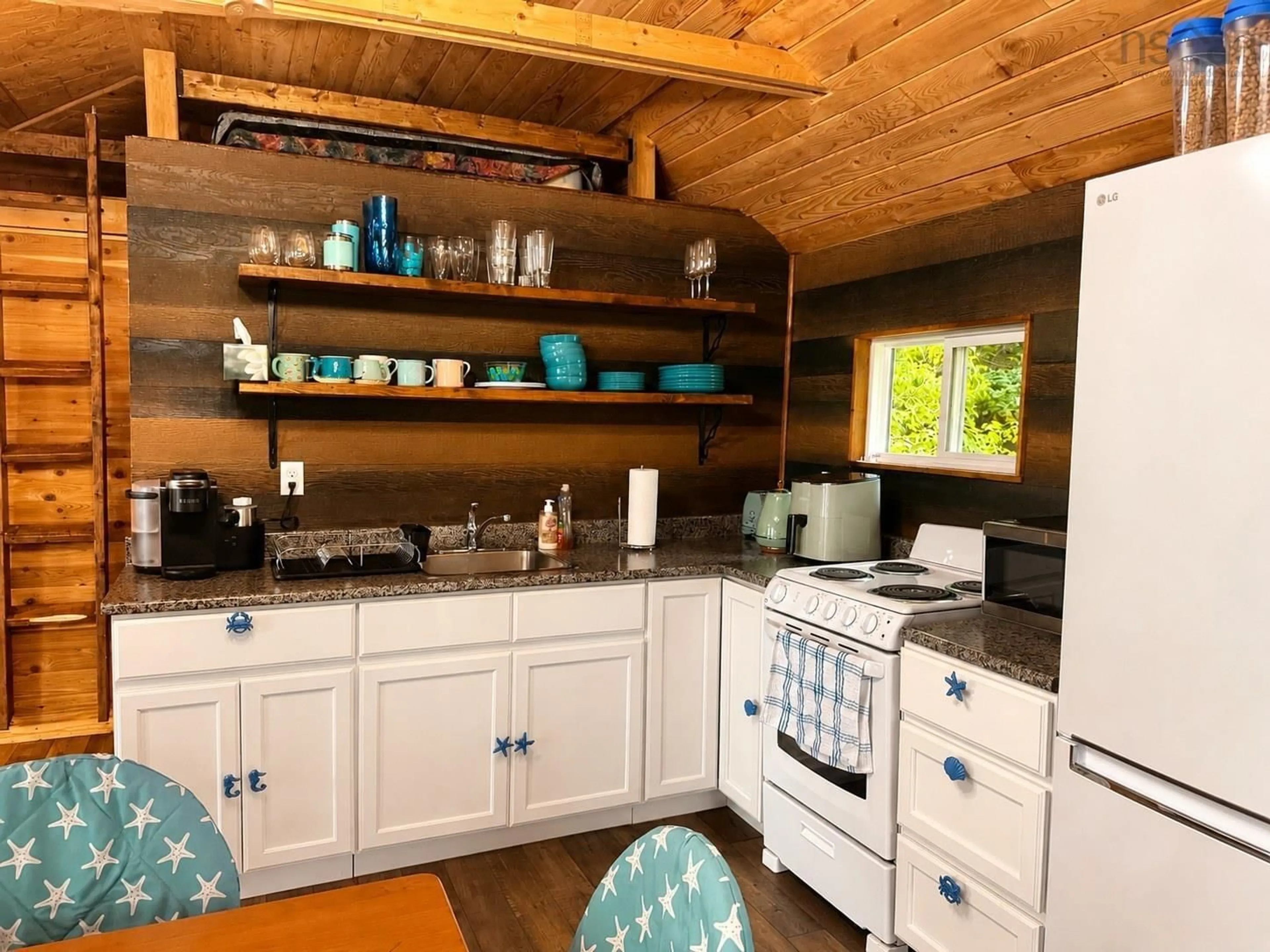 Rustic kitchen, wood/laminate floor for 29 River Lane, Port Philip Nova Scotia B0K 1L0