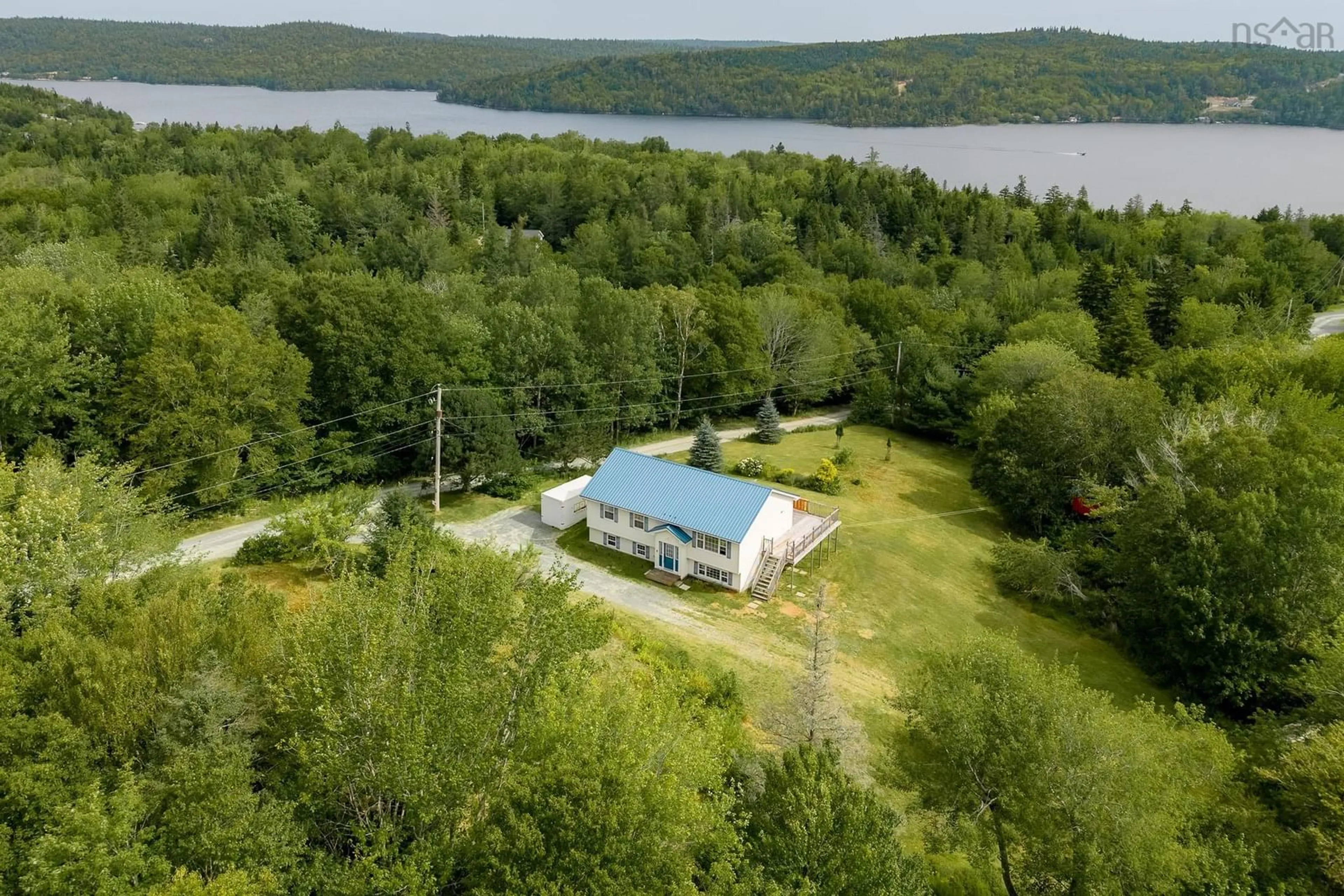 A pic from outside/outdoor area/front of a property/back of a property/a pic from drone, water/lake/river/ocean view for 359 Myra Rd, Porters Lake Nova Scotia B3E 1G2