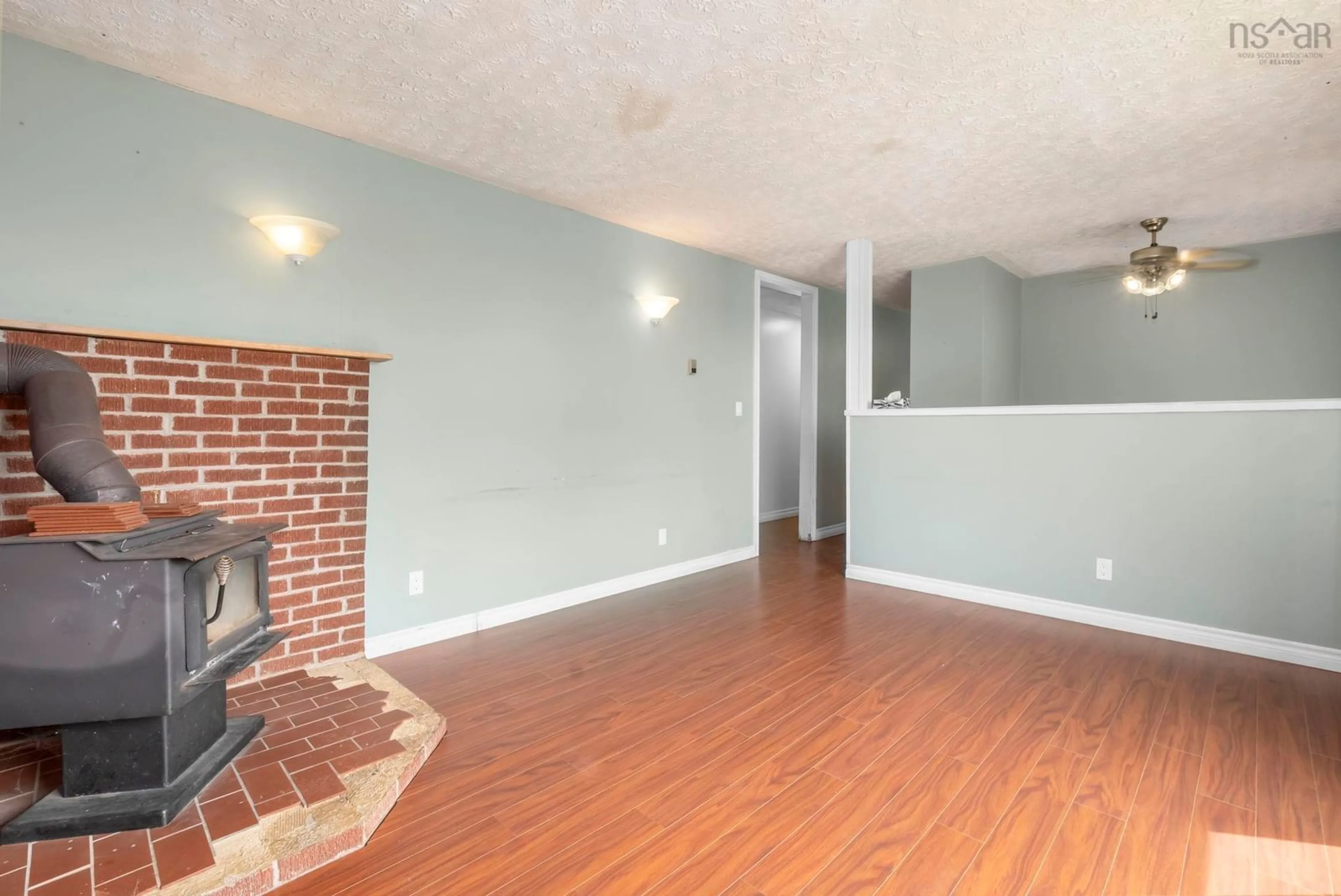 Living room with furniture, wood/laminate floor for 1550 Highway 358, Port Williams Nova Scotia B0P 1T0