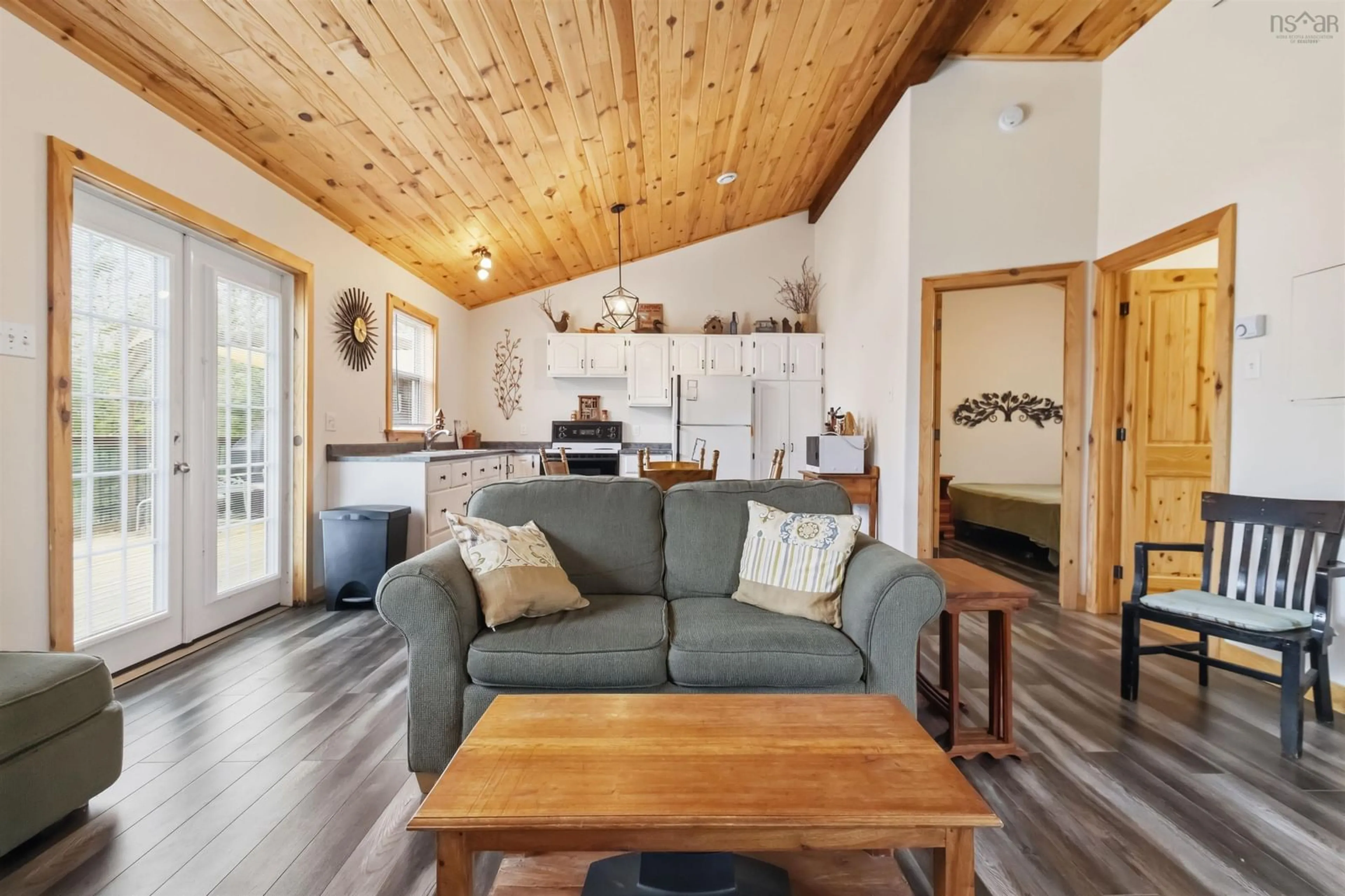 Living room with furniture, wood/laminate floor for 630 Elmwood Exten, Barss Corner Nova Scotia B0R 1A0