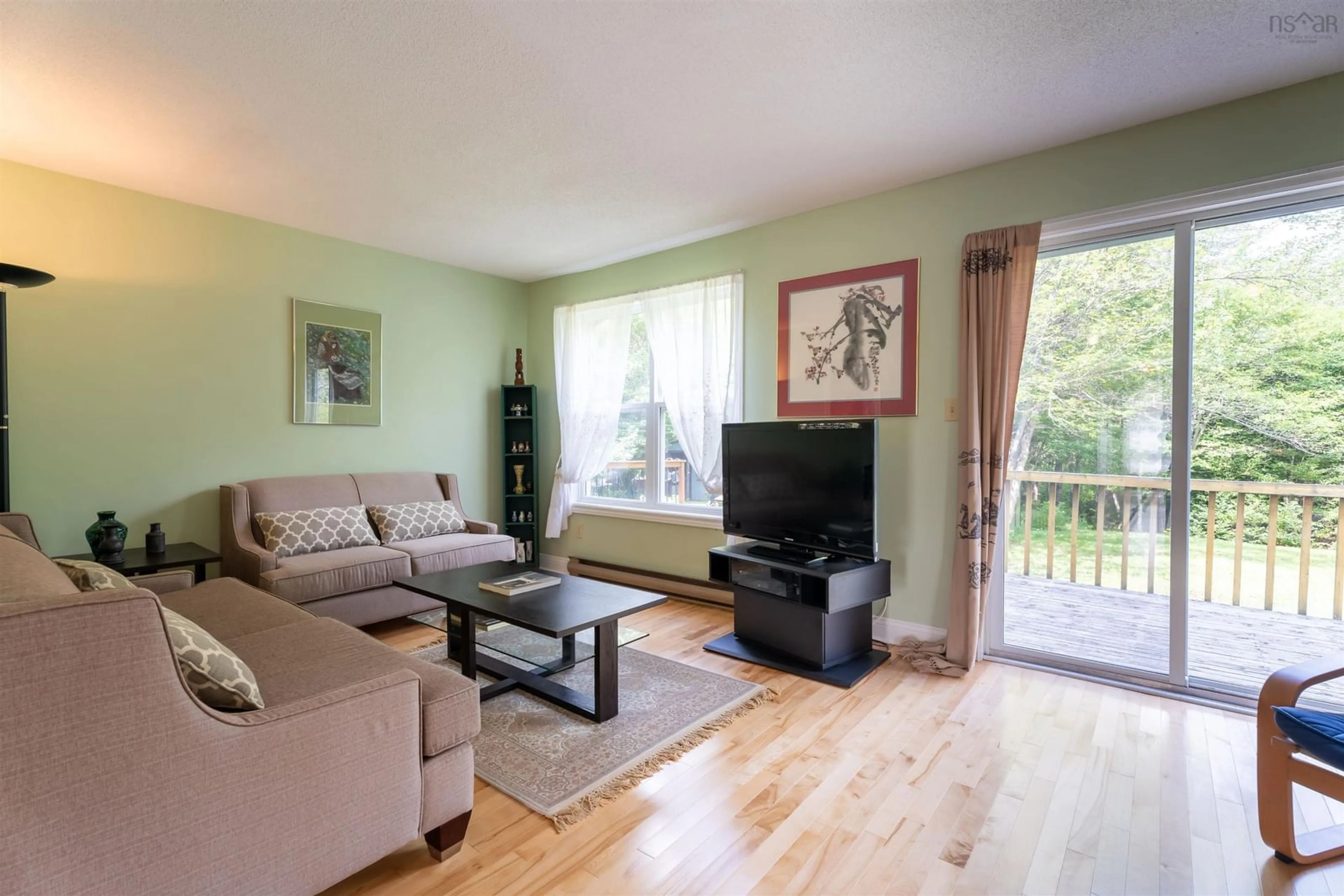 Living room with furniture, wood/laminate floor for 20 Governors Lake Dr, Timberlea Nova Scotia B3T 1N2