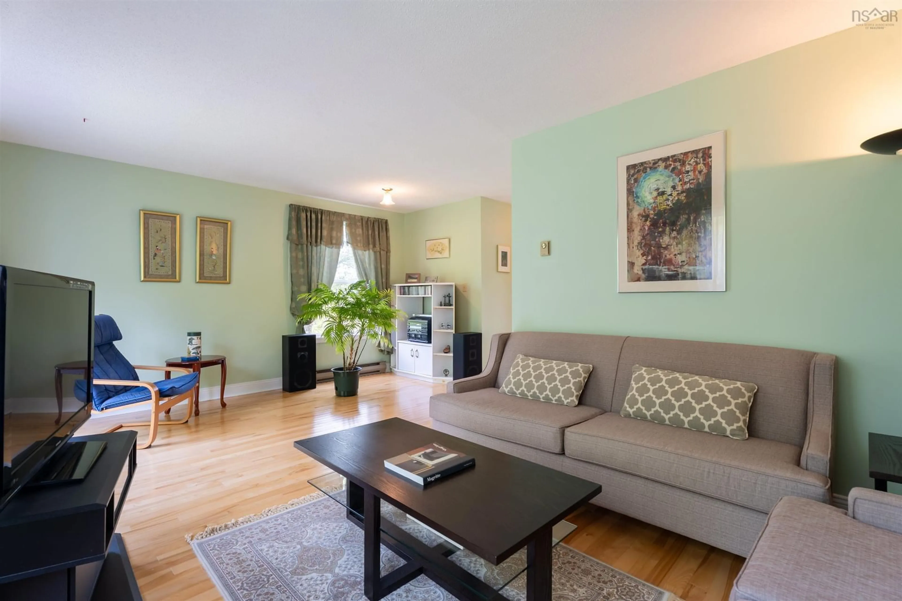 Living room with furniture, wood/laminate floor for 20 Governors Lake Dr, Timberlea Nova Scotia B3T 1N2