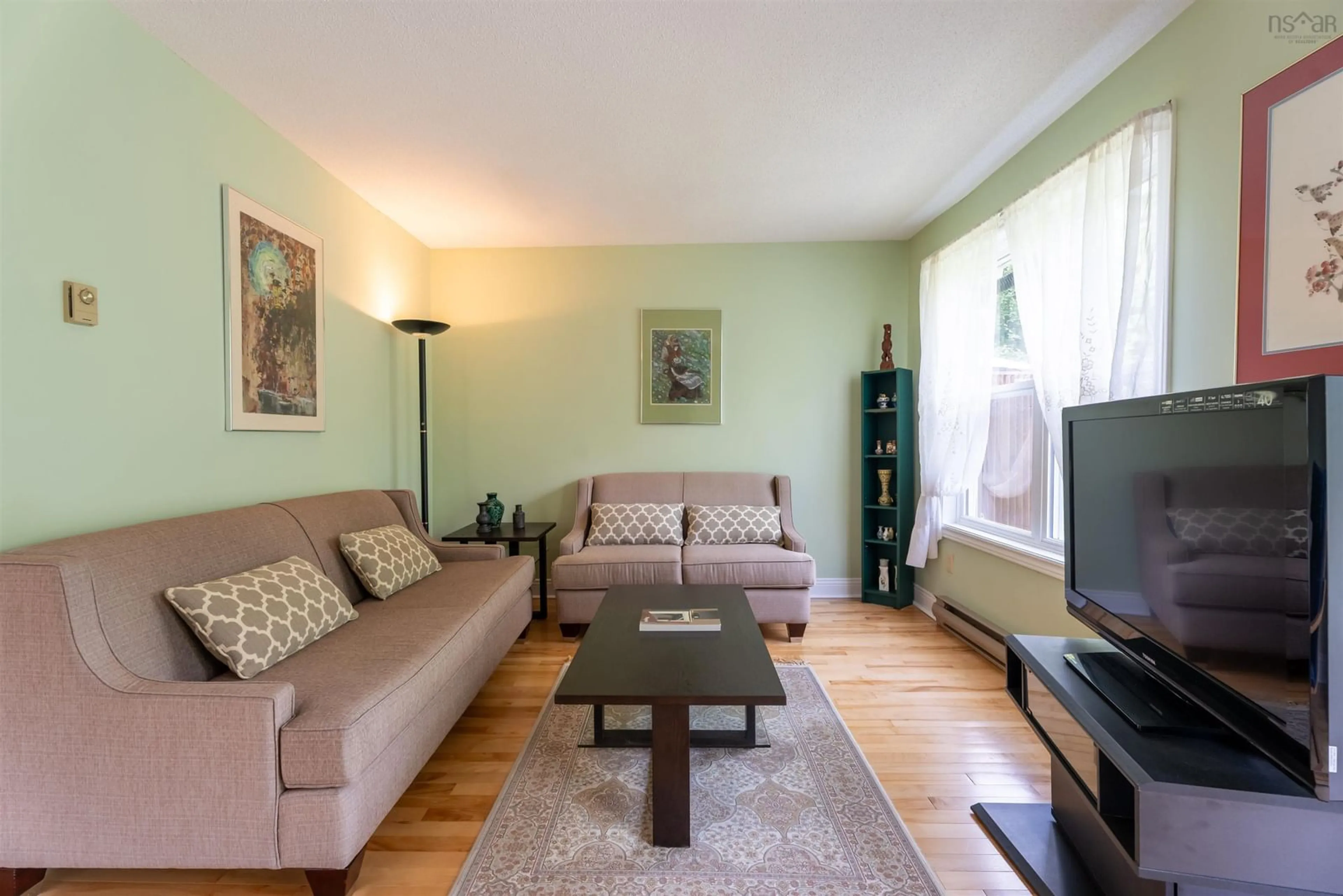 Living room with furniture, wood/laminate floor for 20 Governors Lake Dr, Timberlea Nova Scotia B3T 1N2