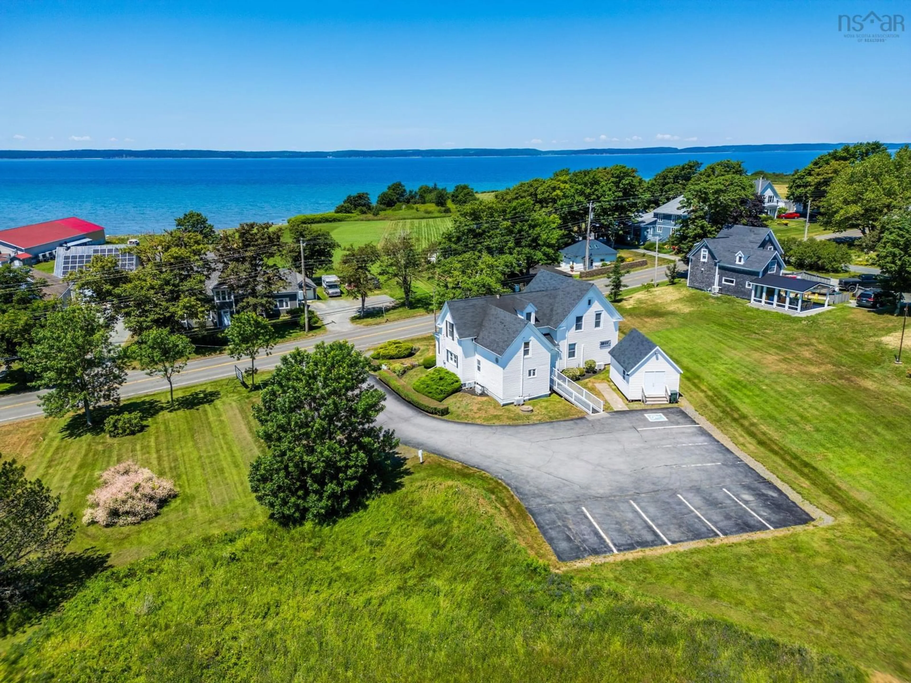 A pic from outside/outdoor area/front of a property/back of a property/a pic from drone, water/lake/river/ocean view for 3300 Highway 1, Belliveaus Cove Nova Scotia B0W 2J0