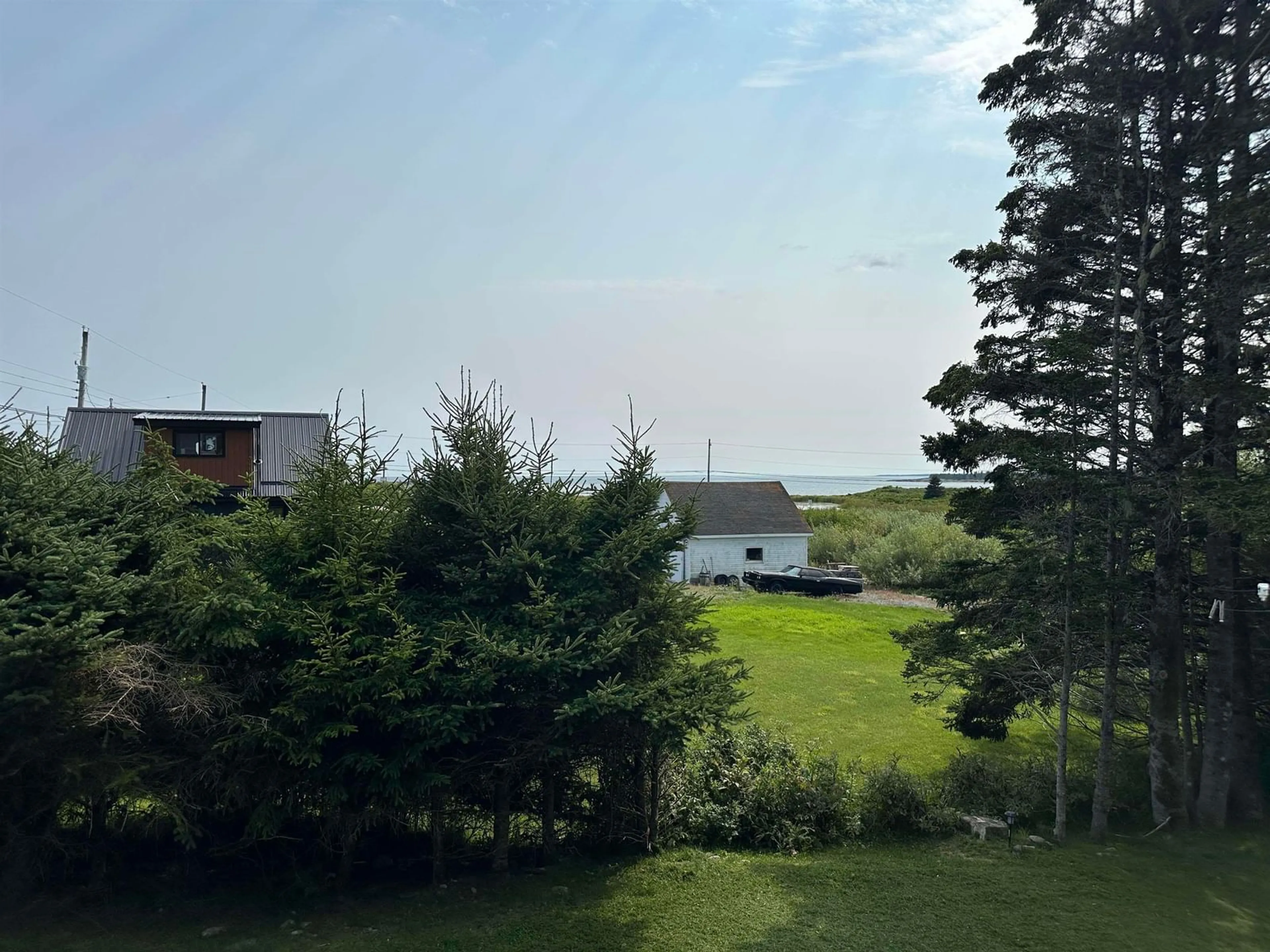 A pic from outside/outdoor area/front of a property/back of a property/a pic from drone, water/lake/river/ocean view for 1833 Eastern Shore Rd, West Berlin Nova Scotia B0J 1H0