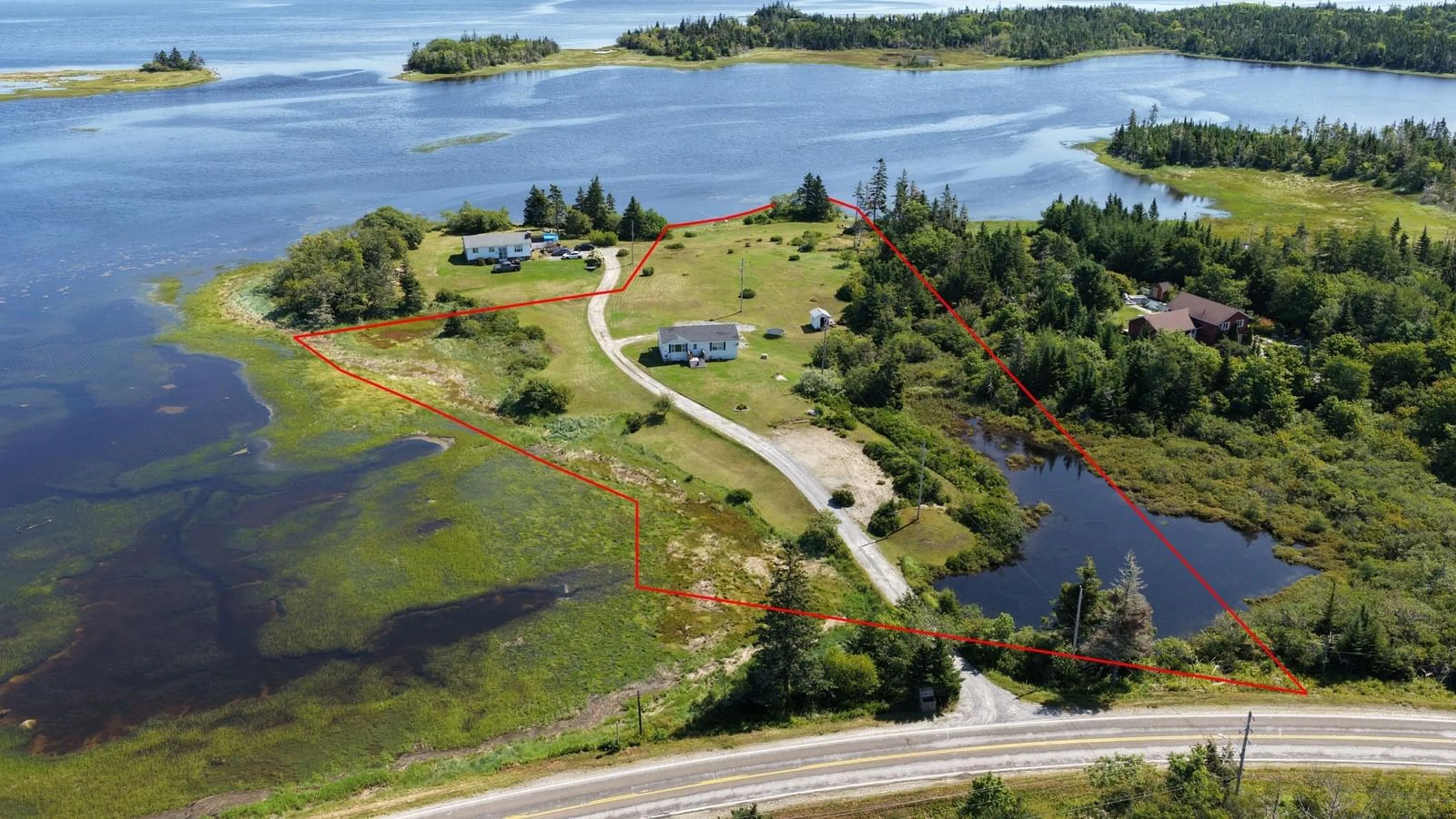 A pic from outside/outdoor area/front of a property/back of a property/a pic from drone, water/lake/river/ocean view for Port Latour Road Eel Bay #1185, Port La Tour Nova Scotia B0W 3L0