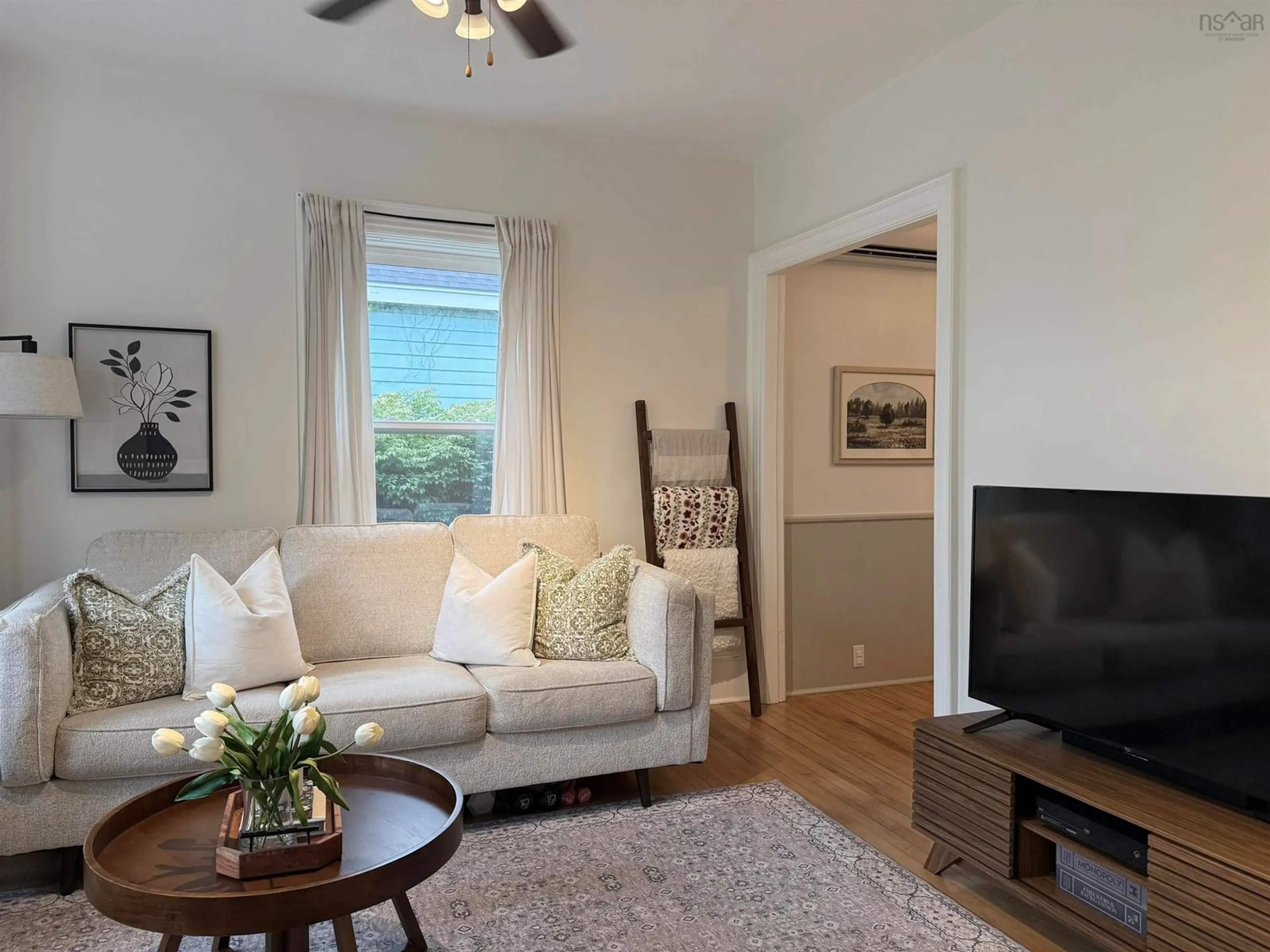 Living room with furniture, wood/laminate floor for 228 Cottage St, New Glasgow Nova Scotia B2H 4E7