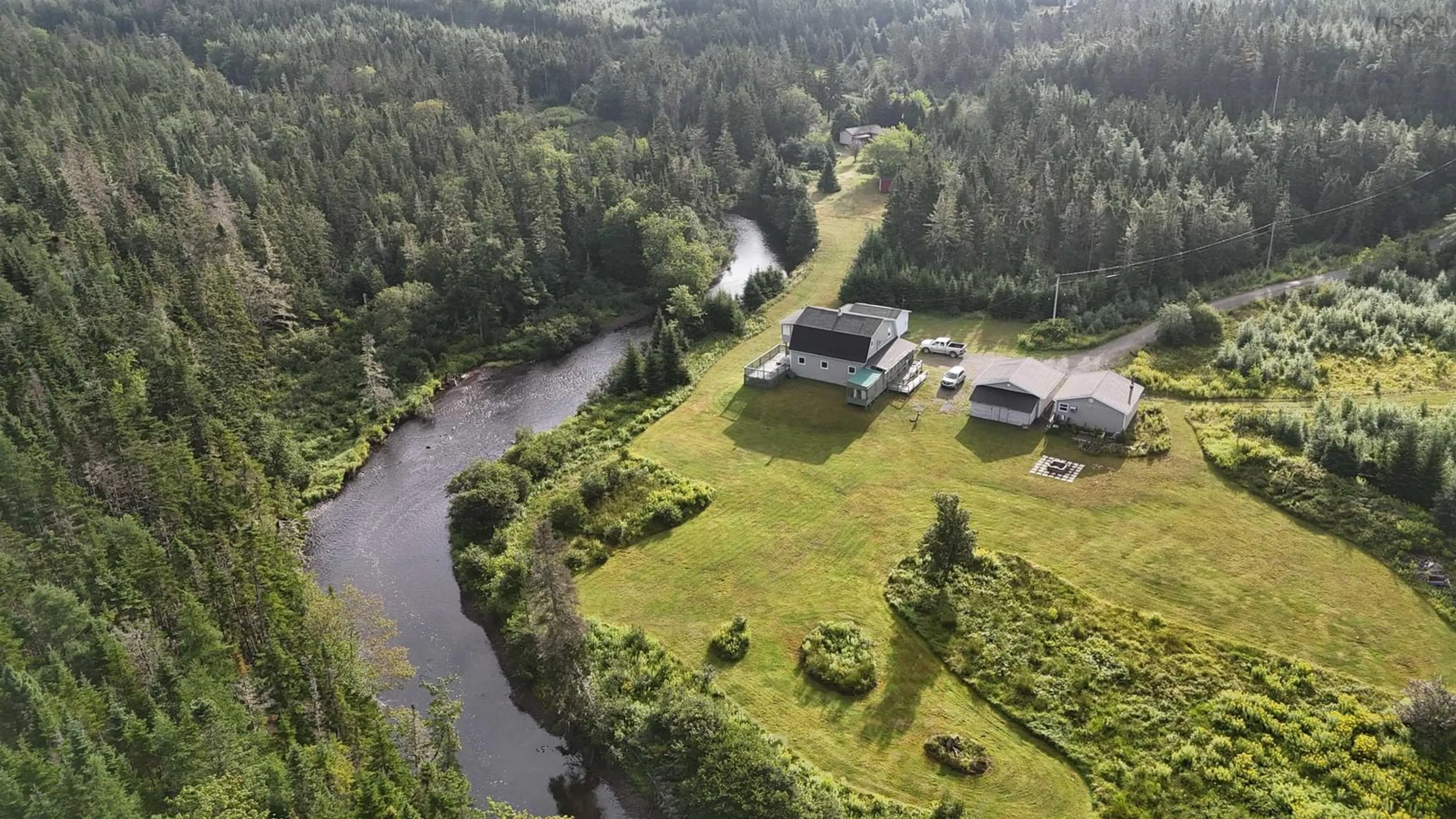 A pic from outside/outdoor area/front of a property/back of a property/a pic from drone, water/lake/river/ocean view for 1235 Loch Lomond Rd, Grand River Falls Nova Scotia B0E 1M0