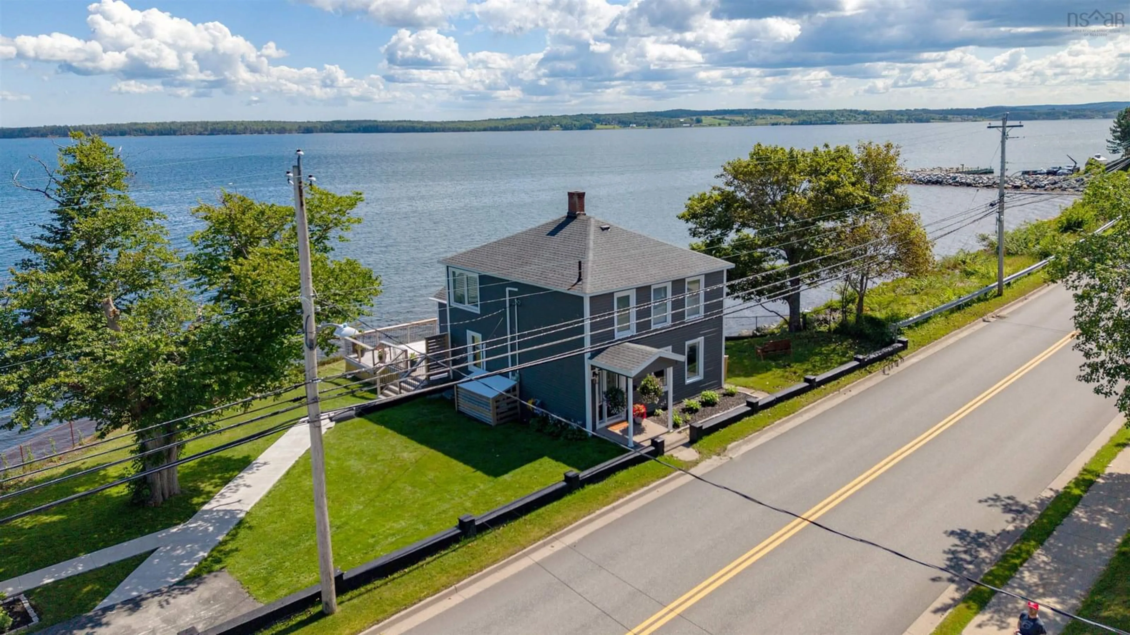 A pic from outside/outdoor area/front of a property/back of a property/a pic from drone, water/lake/river/ocean view for 87 Queen St, North Sydney Nova Scotia B2A 1A7
