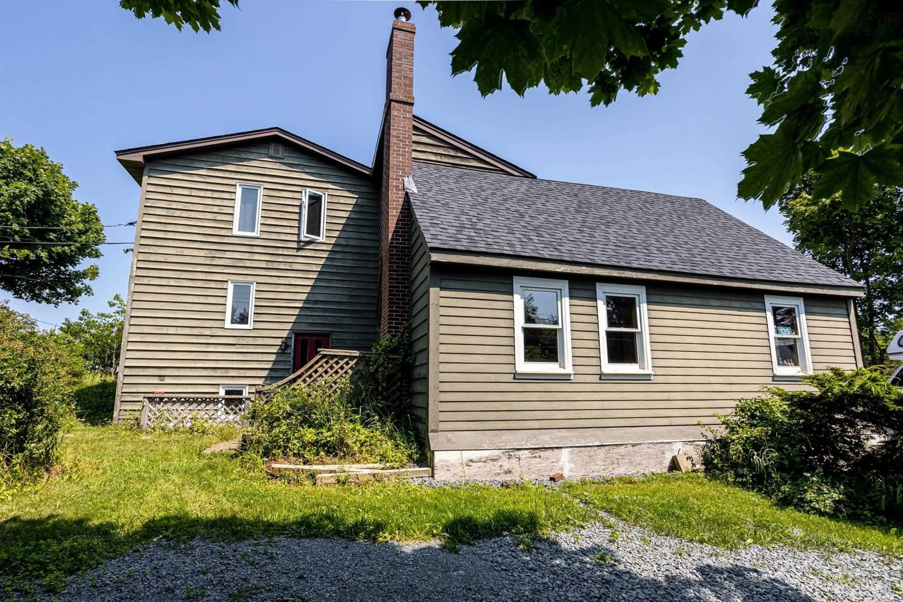 A pic from outside/outdoor area/front of a property/back of a property/a pic from drone, building for 135 Village Rd, Herring Cove Nova Scotia B3V 1H2