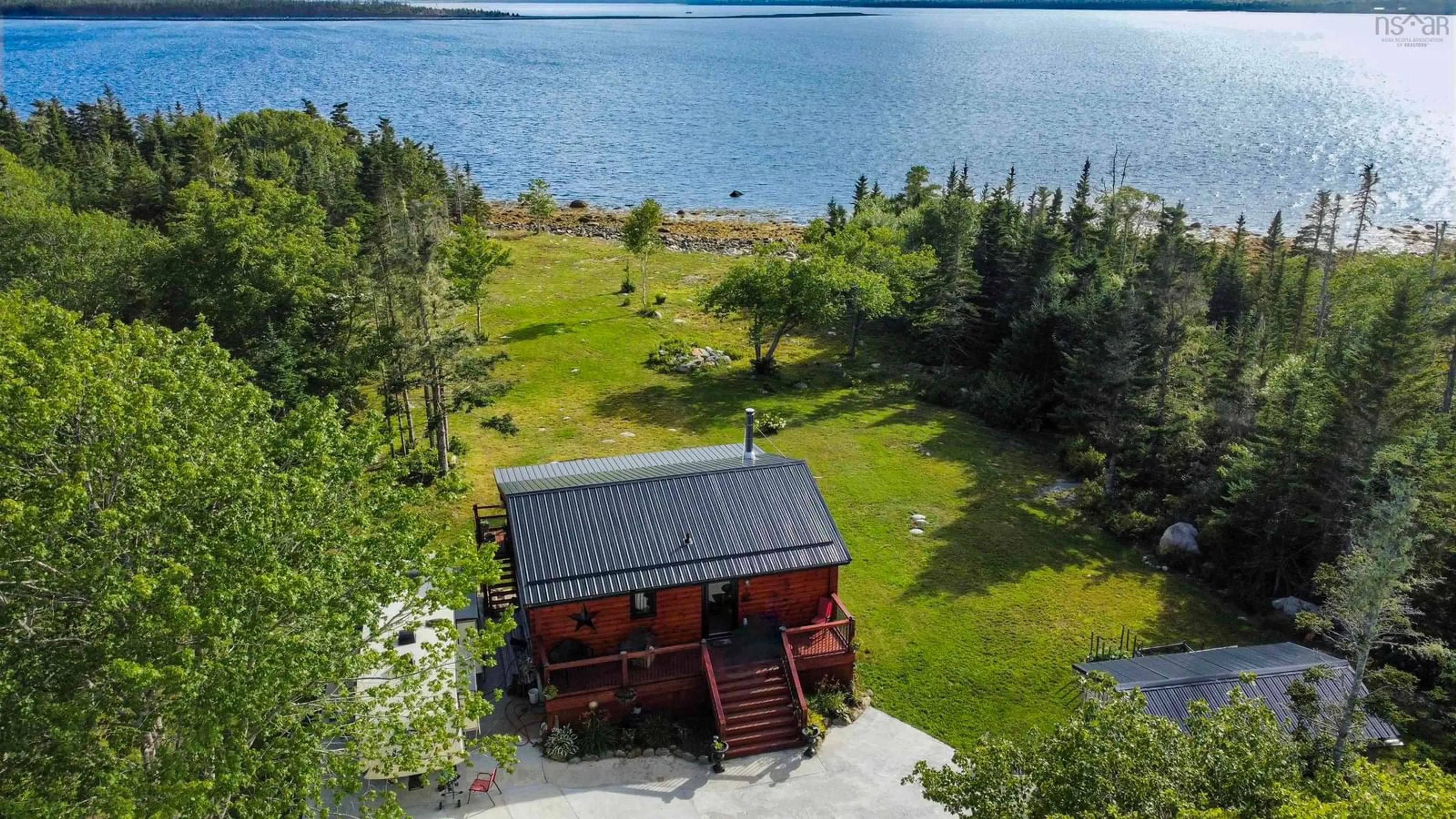 A pic from outside/outdoor area/front of a property/back of a property/a pic from drone, water/lake/river/ocean view for 2250 Sandy Point Rd, Sandy Point Nova Scotia B0T 1W0