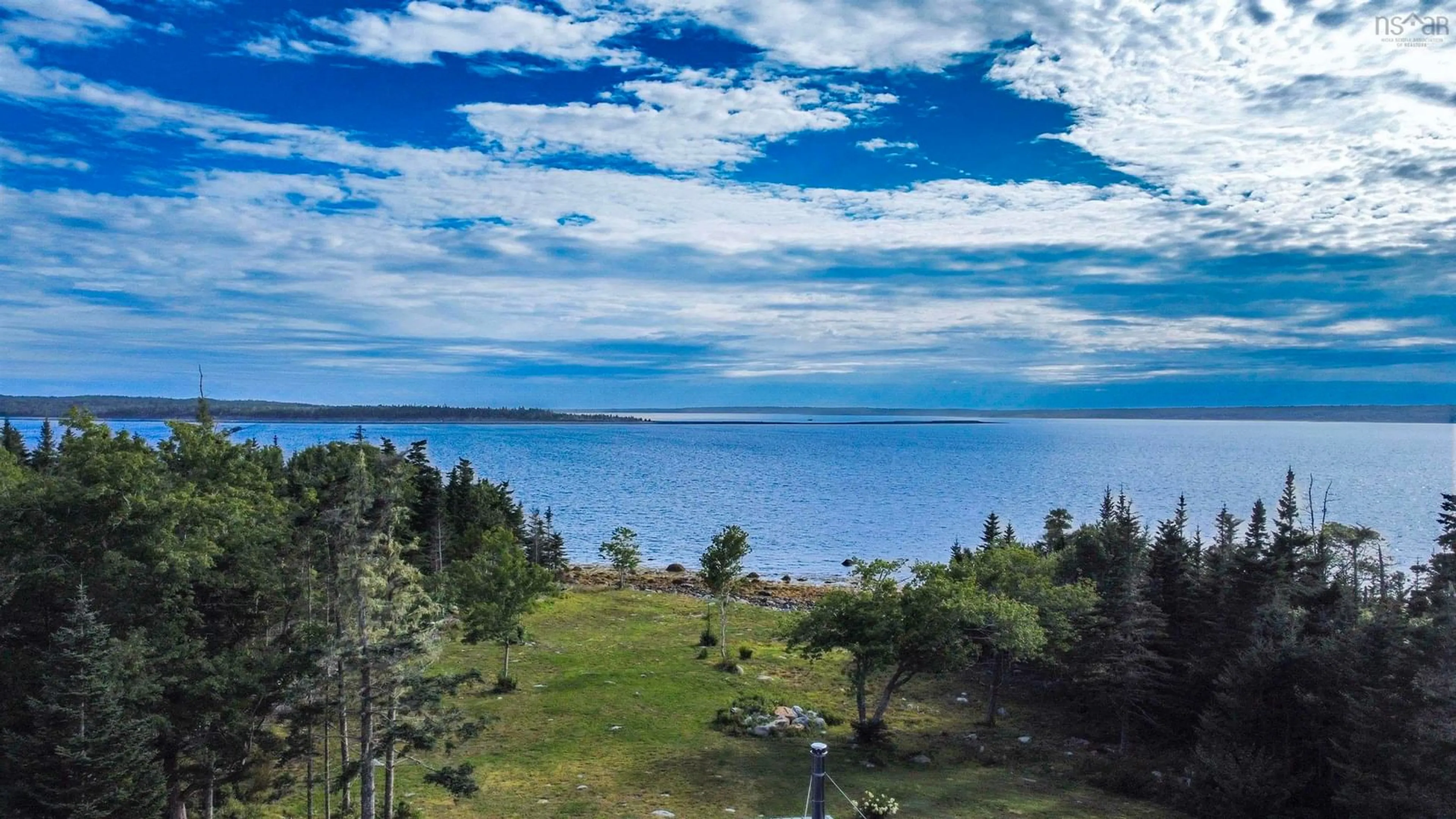 A pic from outside/outdoor area/front of a property/back of a property/a pic from drone, water/lake/river/ocean view for 2250 Sandy Point Rd, Sandy Point Nova Scotia B0T 1W0