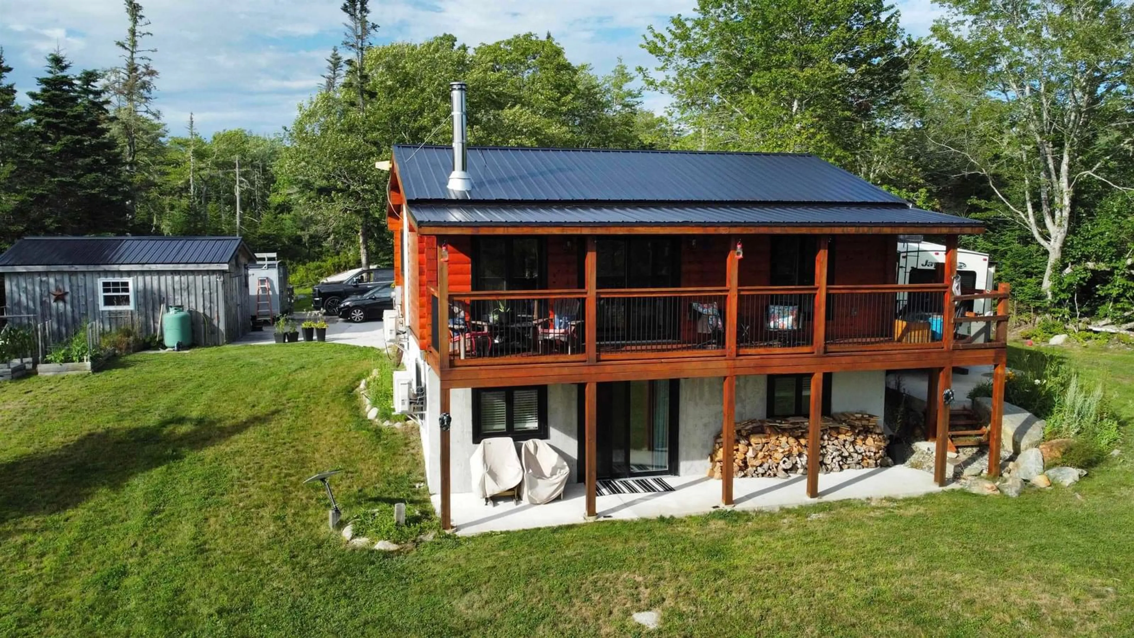 A pic from outside/outdoor area/front of a property/back of a property/a pic from drone, building for 2250 Sandy Point Rd, Sandy Point Nova Scotia B0T 1W0