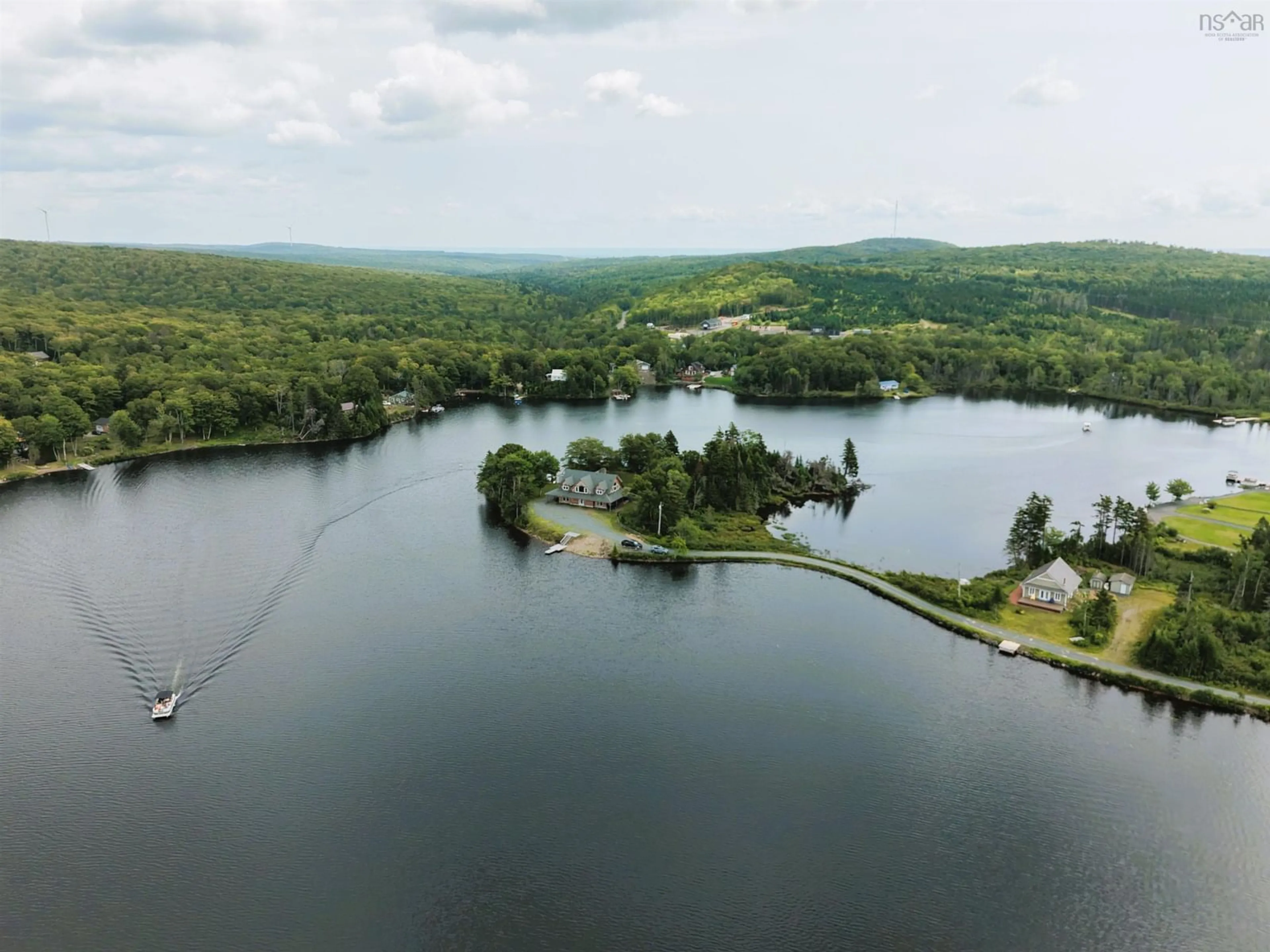 A pic from outside/outdoor area/front of a property/back of a property/a pic from drone, water/lake/river/ocean view for 47 Pats Blvd, Sutherlands Lake Nova Scotia B0M 1M0
