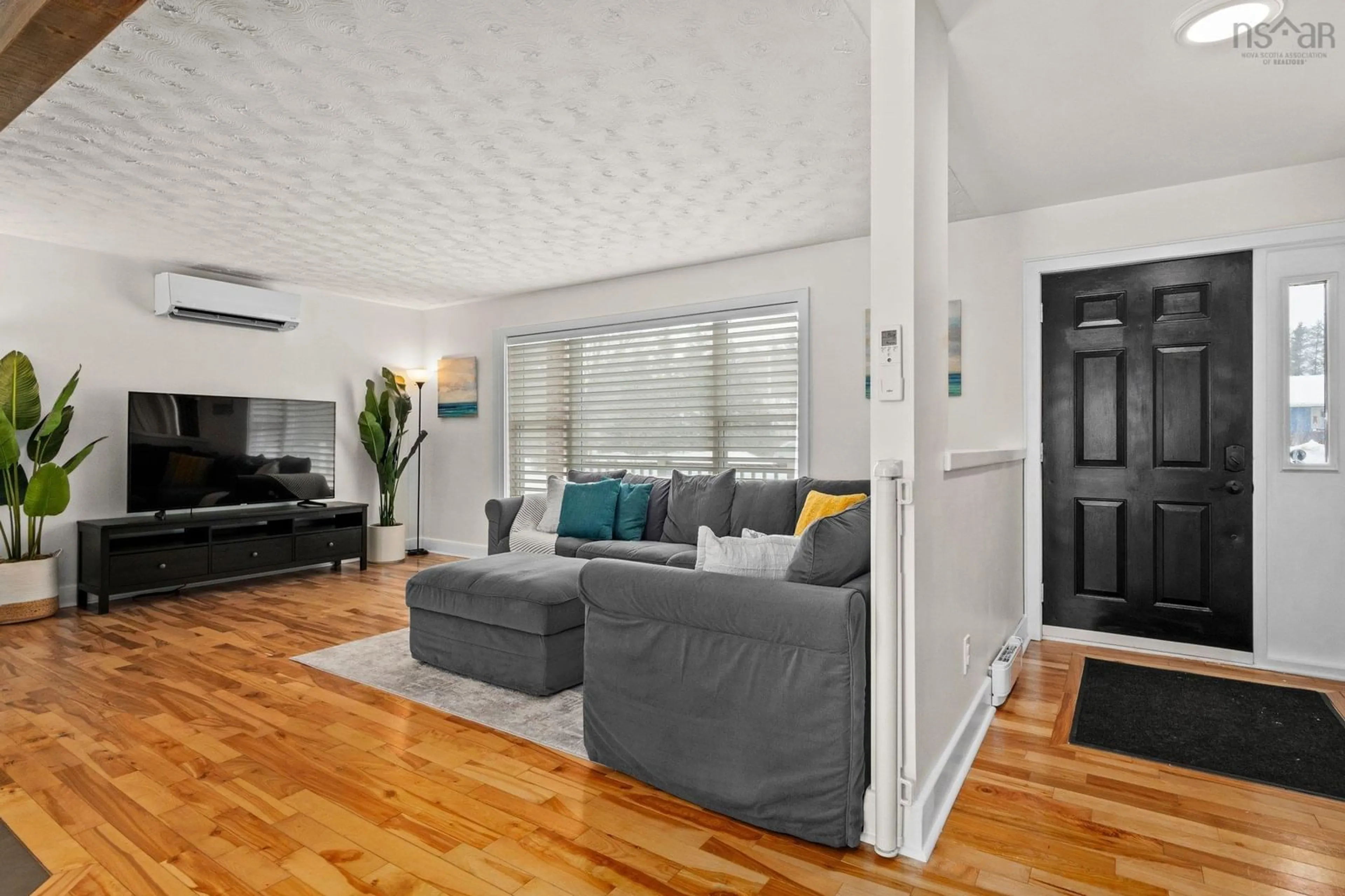 Living room with furniture, wood/laminate floor for 84 Pine Crt, Wilmot Nova Scotia B0P 1R0