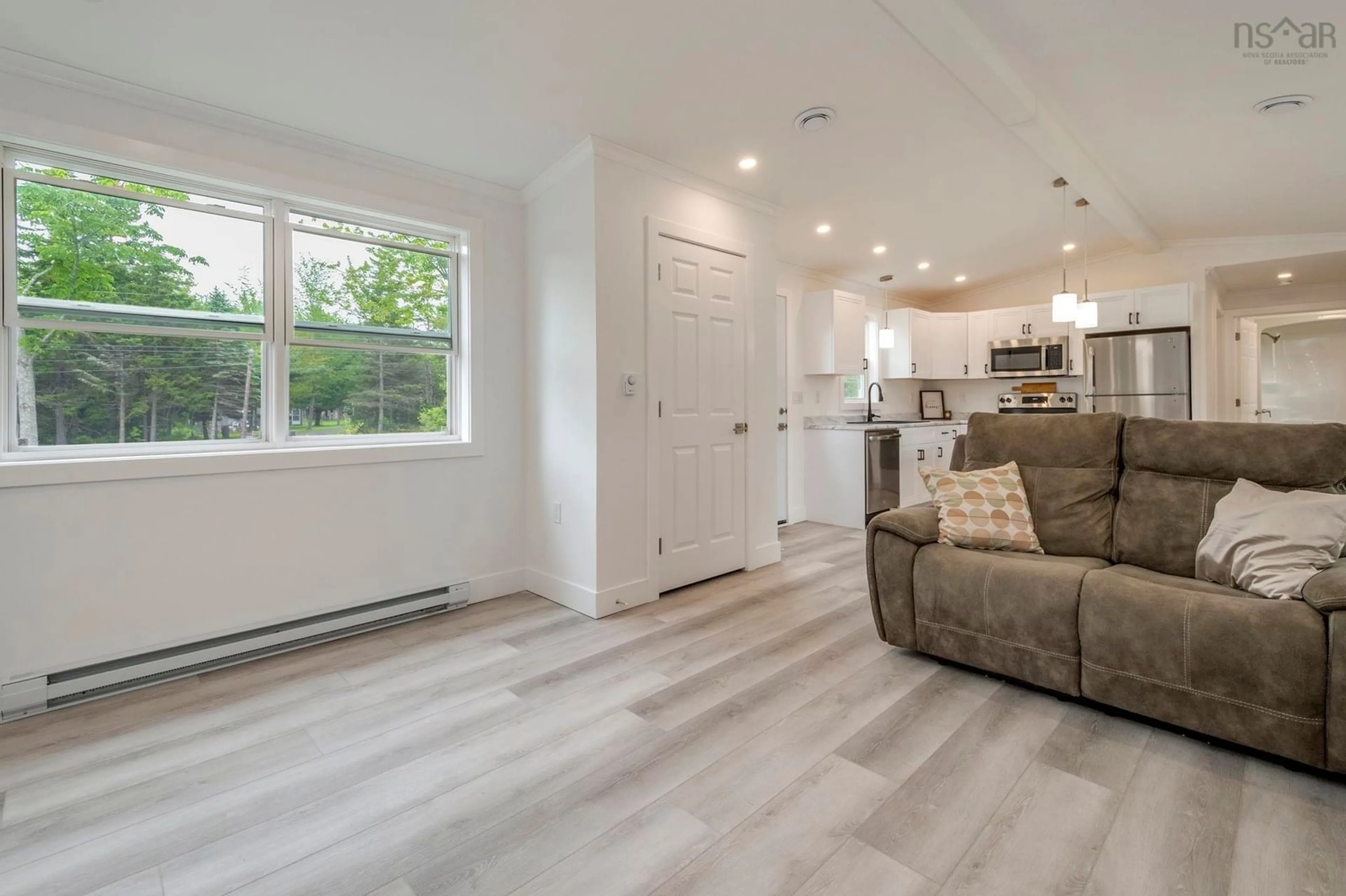 Open concept kitchen, wood/laminate floor for 7200 Highway 6, Three Brooks Nova Scotia B0K 1H0