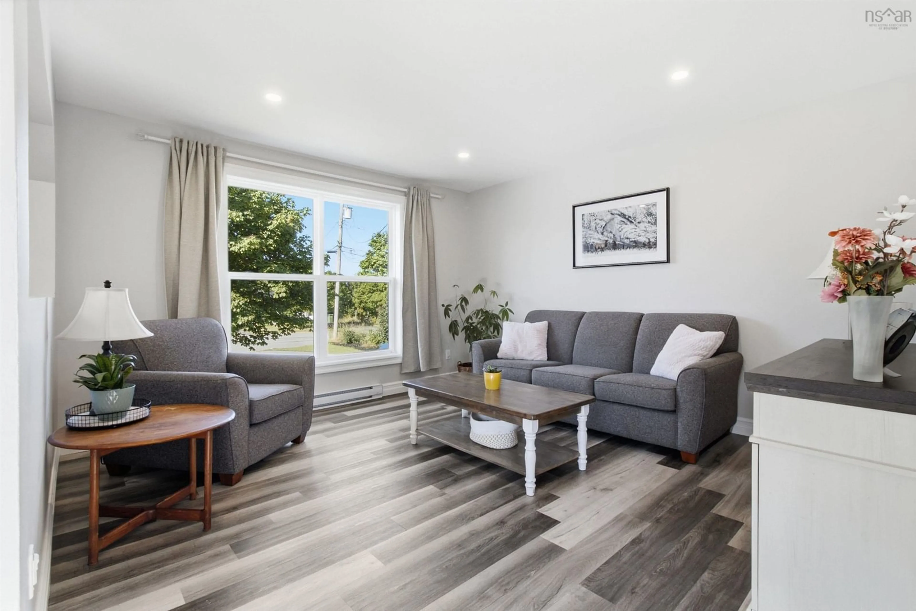 Living room with furniture, wood/laminate floor for 6 Newberry Crt, Woodside Nova Scotia B2W 6B5