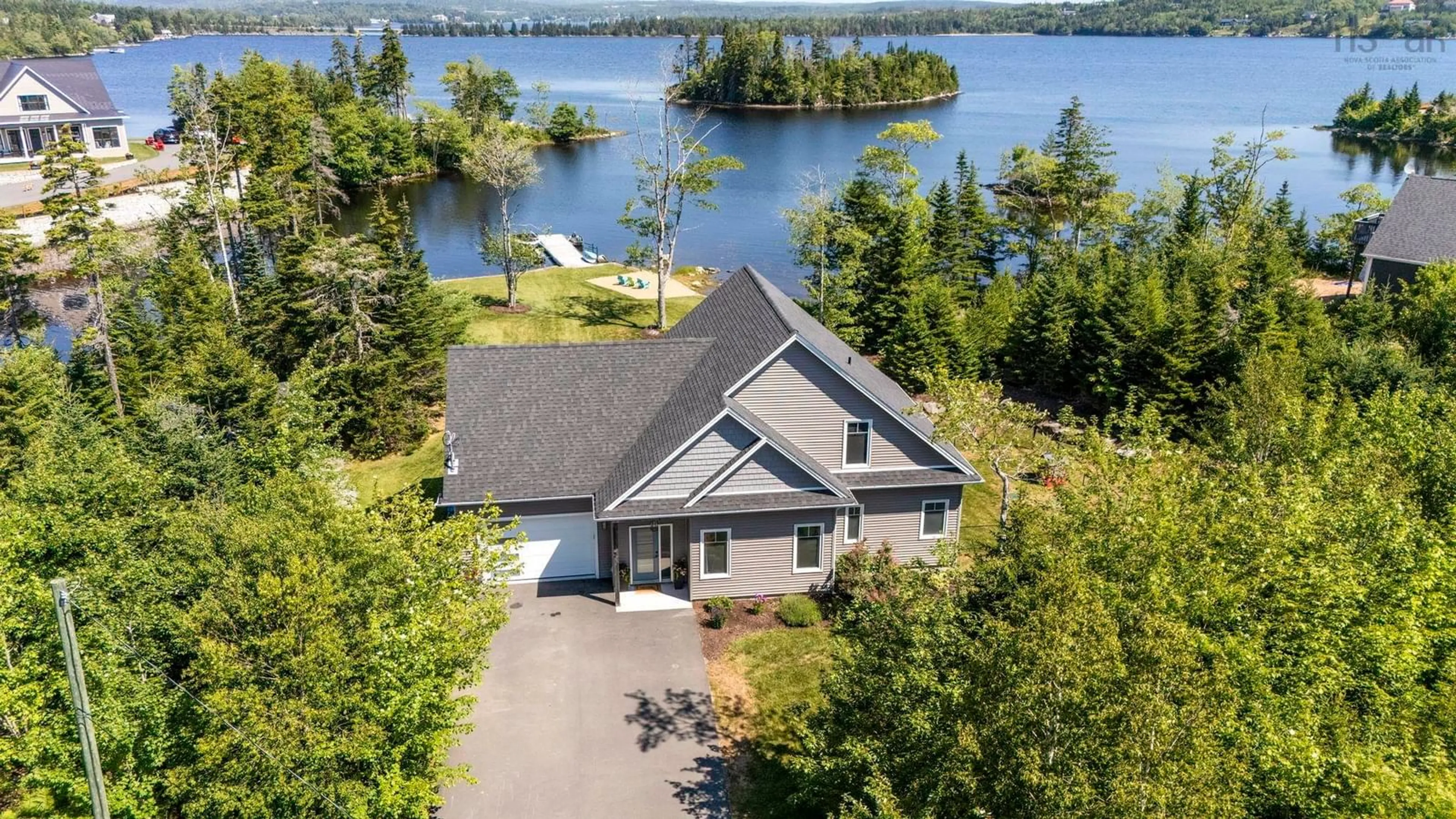 A pic from outside/outdoor area/front of a property/back of a property/a pic from drone, water/lake/river/ocean view for 3 Fiddlehead, Porters Lake Nova Scotia B3E 1P4