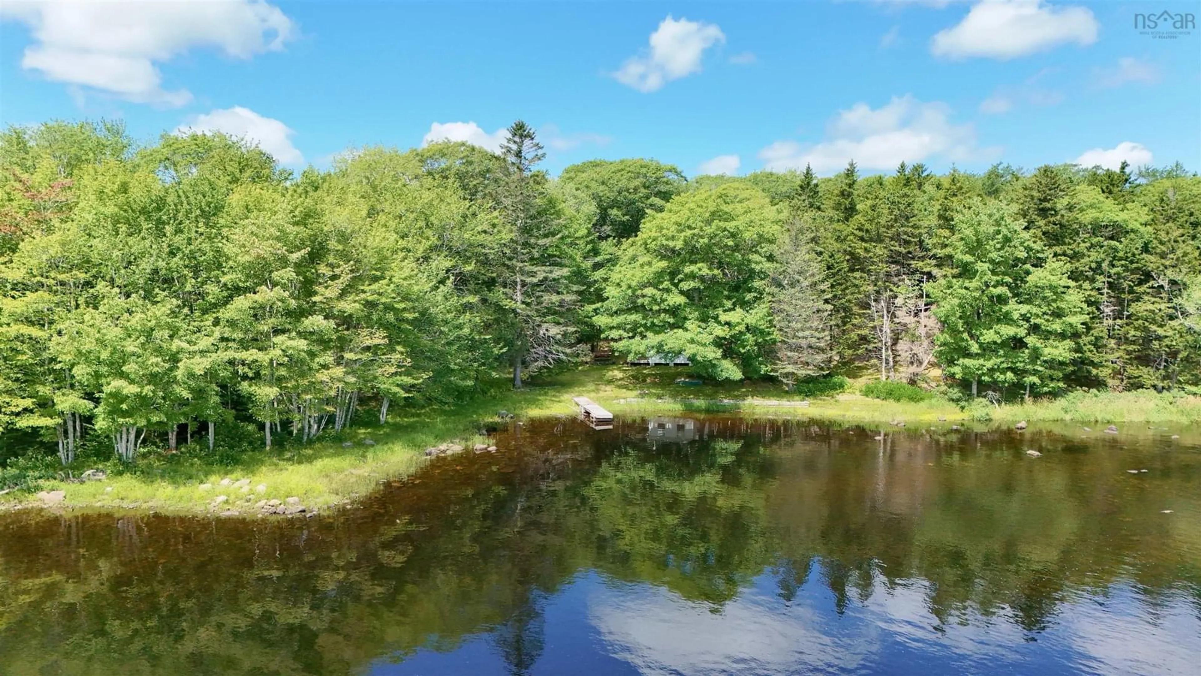 A pic from outside/outdoor area/front of a property/back of a property/a pic from drone, water/lake/river/ocean view for 4364 Highway 340, Carleton Nova Scotia B5A 5P9