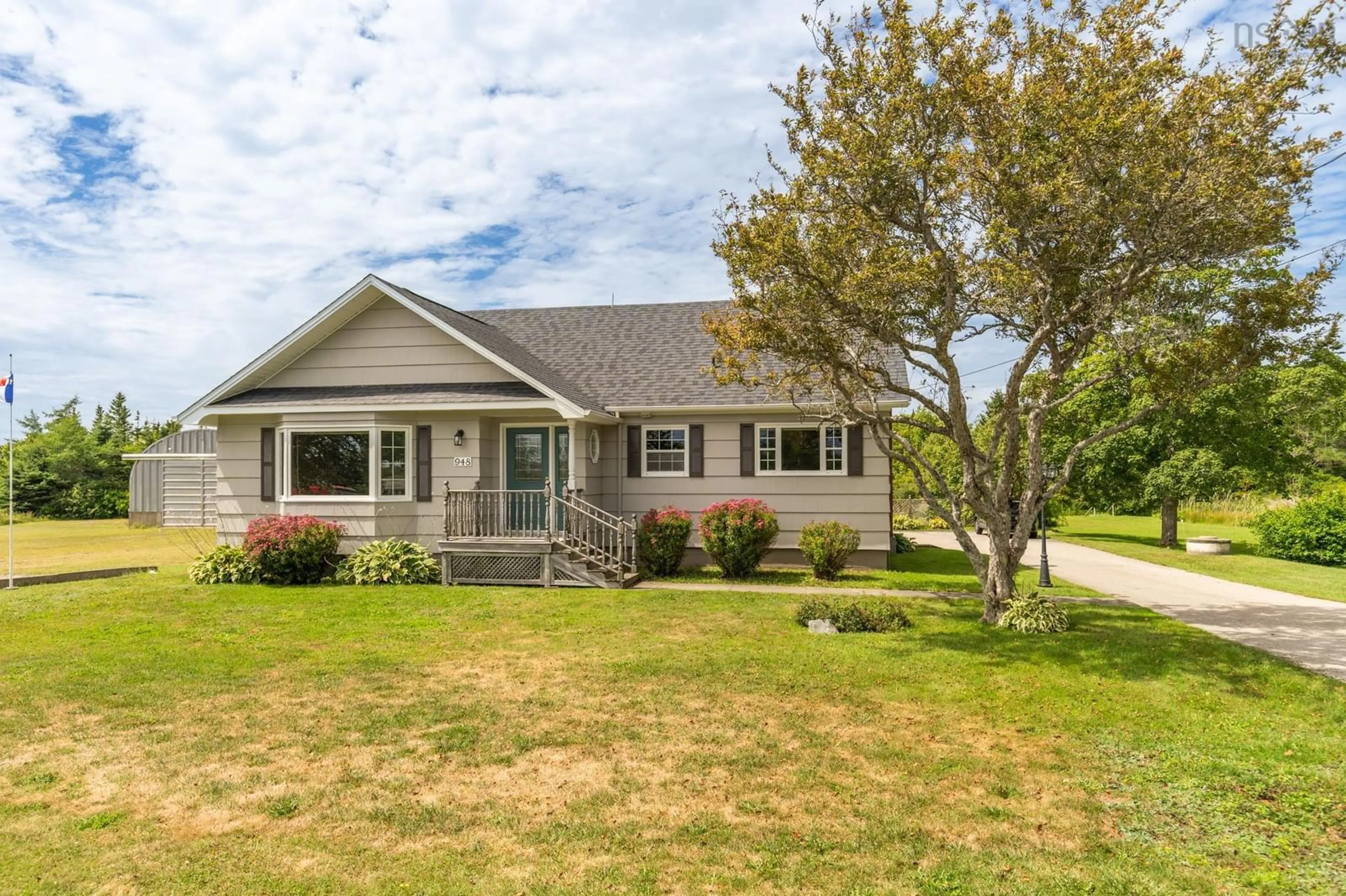 Home with vinyl exterior material, street for 948 Highway 335, West Pubnico Nova Scotia B0W 3S0