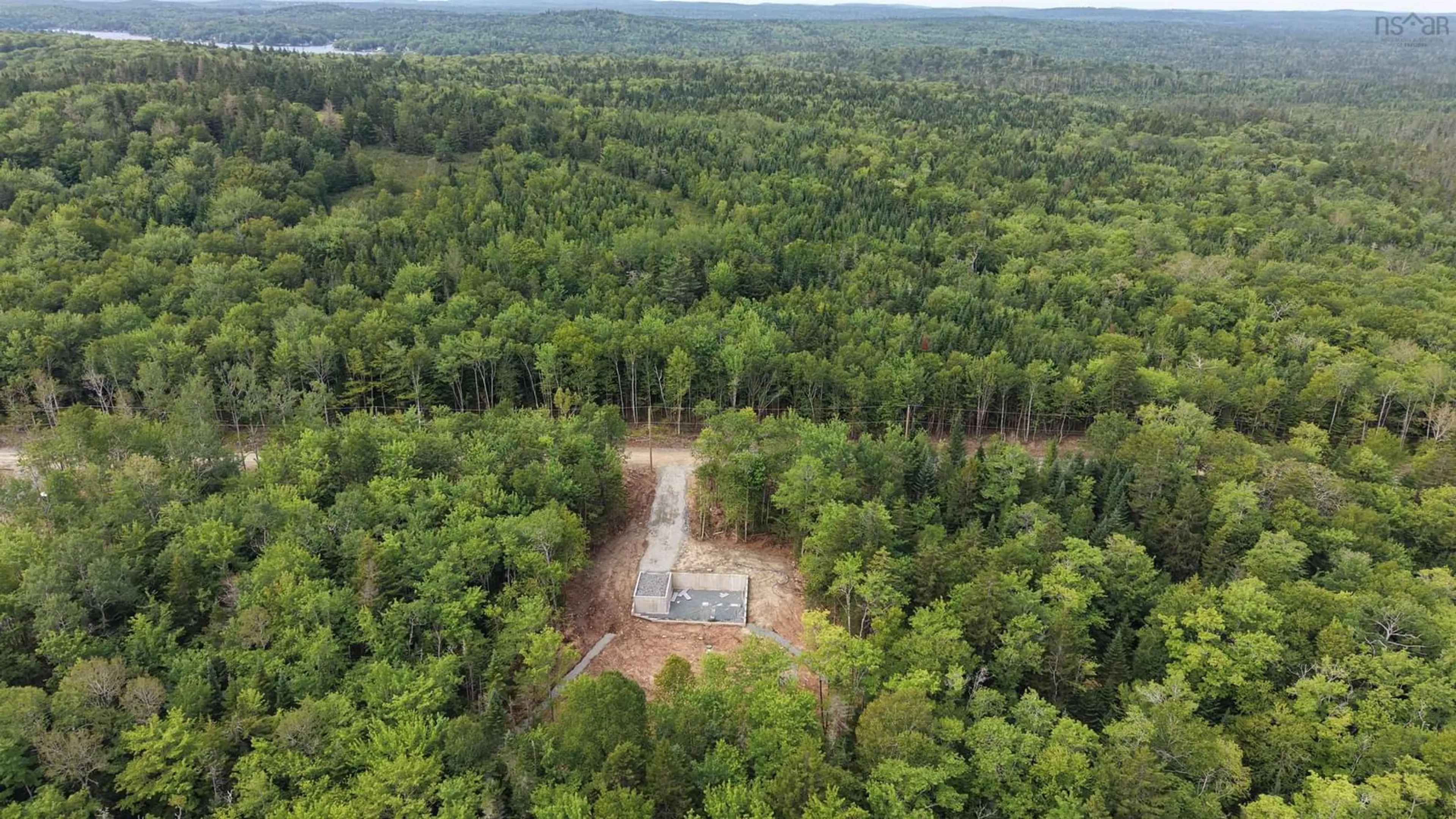 A pic from outside/outdoor area/front of a property/back of a property/a pic from drone, forest/trees view for 82 Ronald Lane, East Uniacke Nova Scotia B0N 1Z0