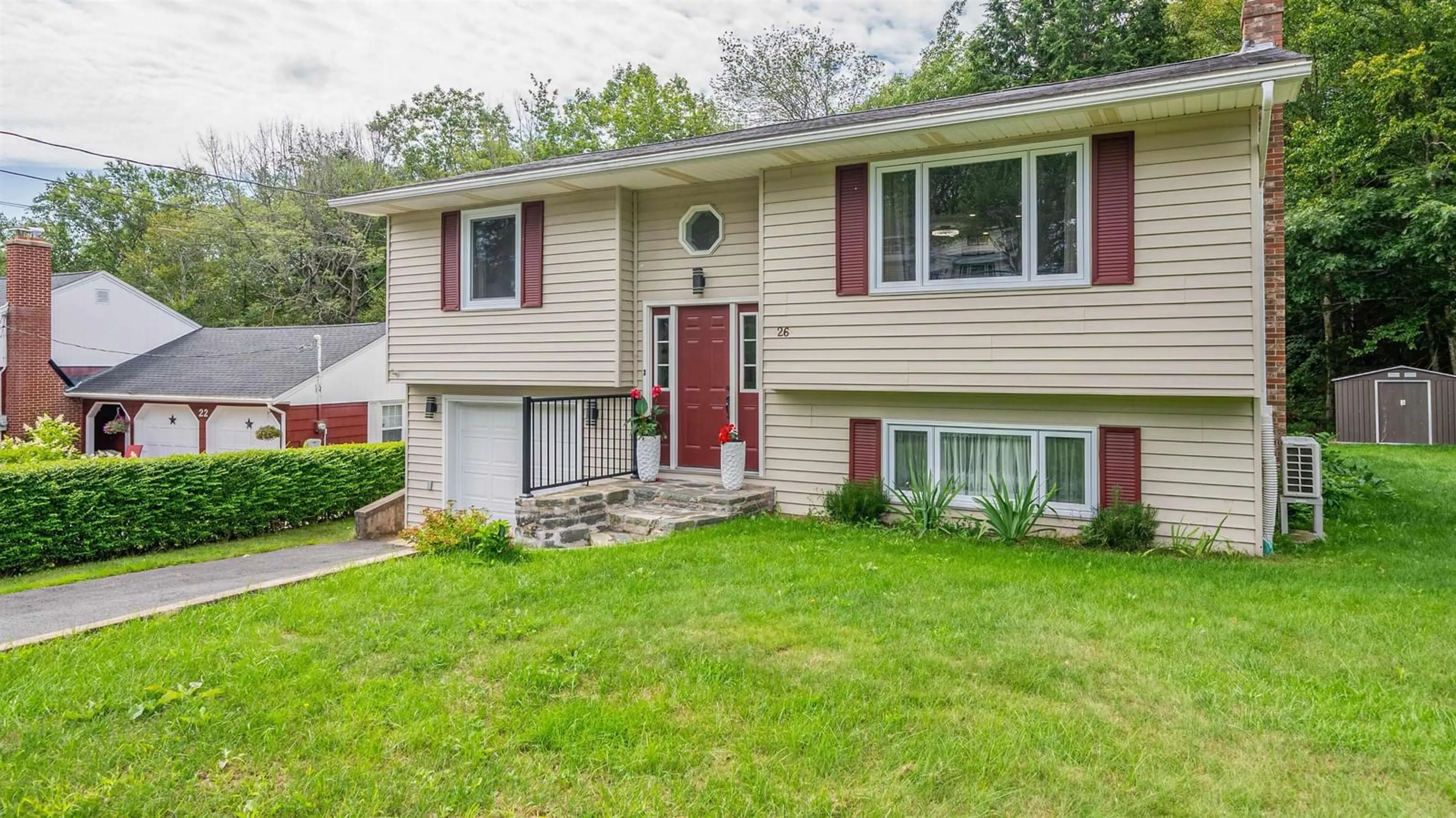 Home with vinyl exterior material, street for 26 Bridge St, Bedford Nova Scotia B4A 2C1
