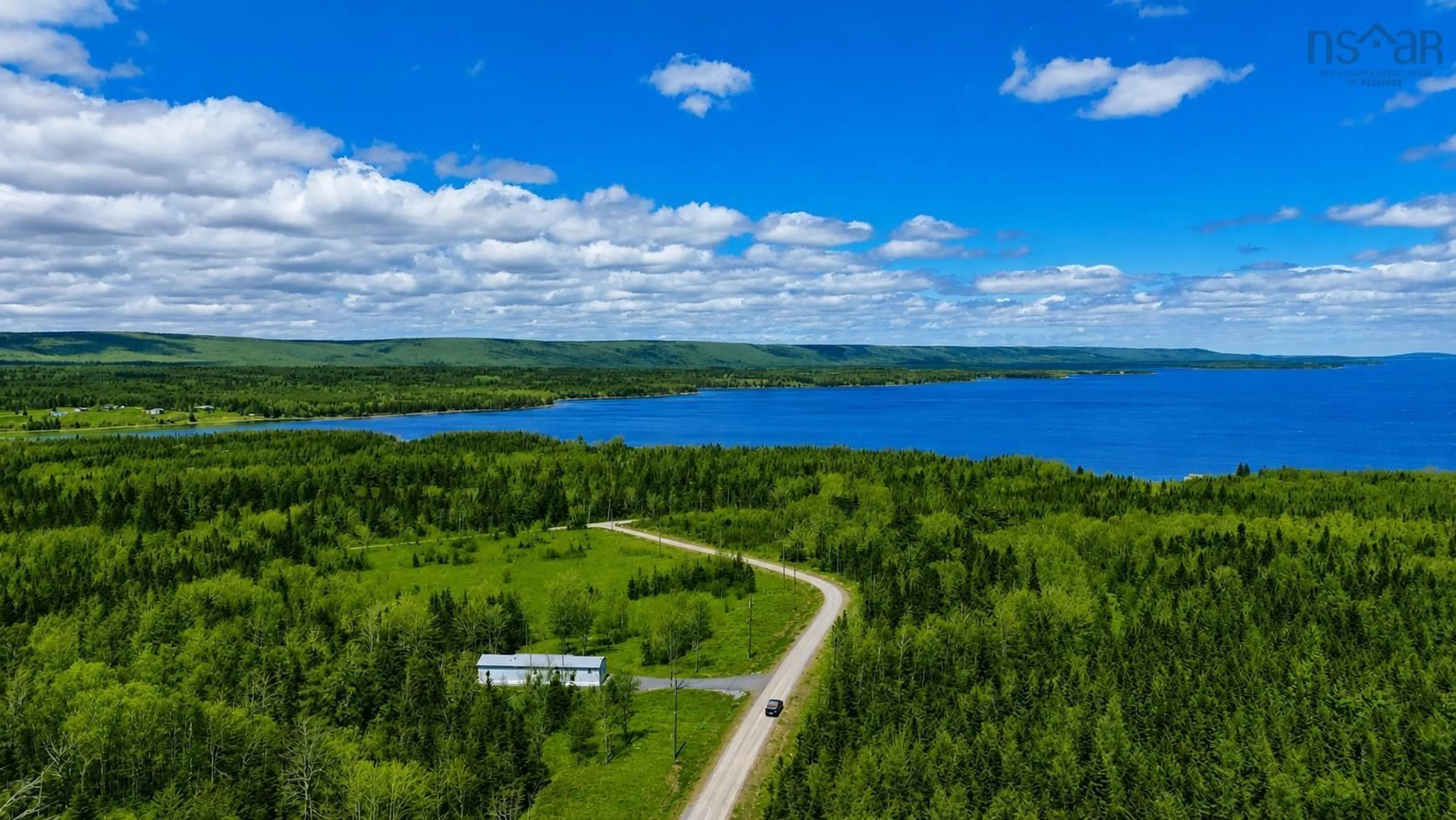 A pic from outside/outdoor area/front of a property/back of a property/a pic from drone, water/lake/river/ocean view for 62 Mash Lane, West Bay Nova Scotia B0E 3K0