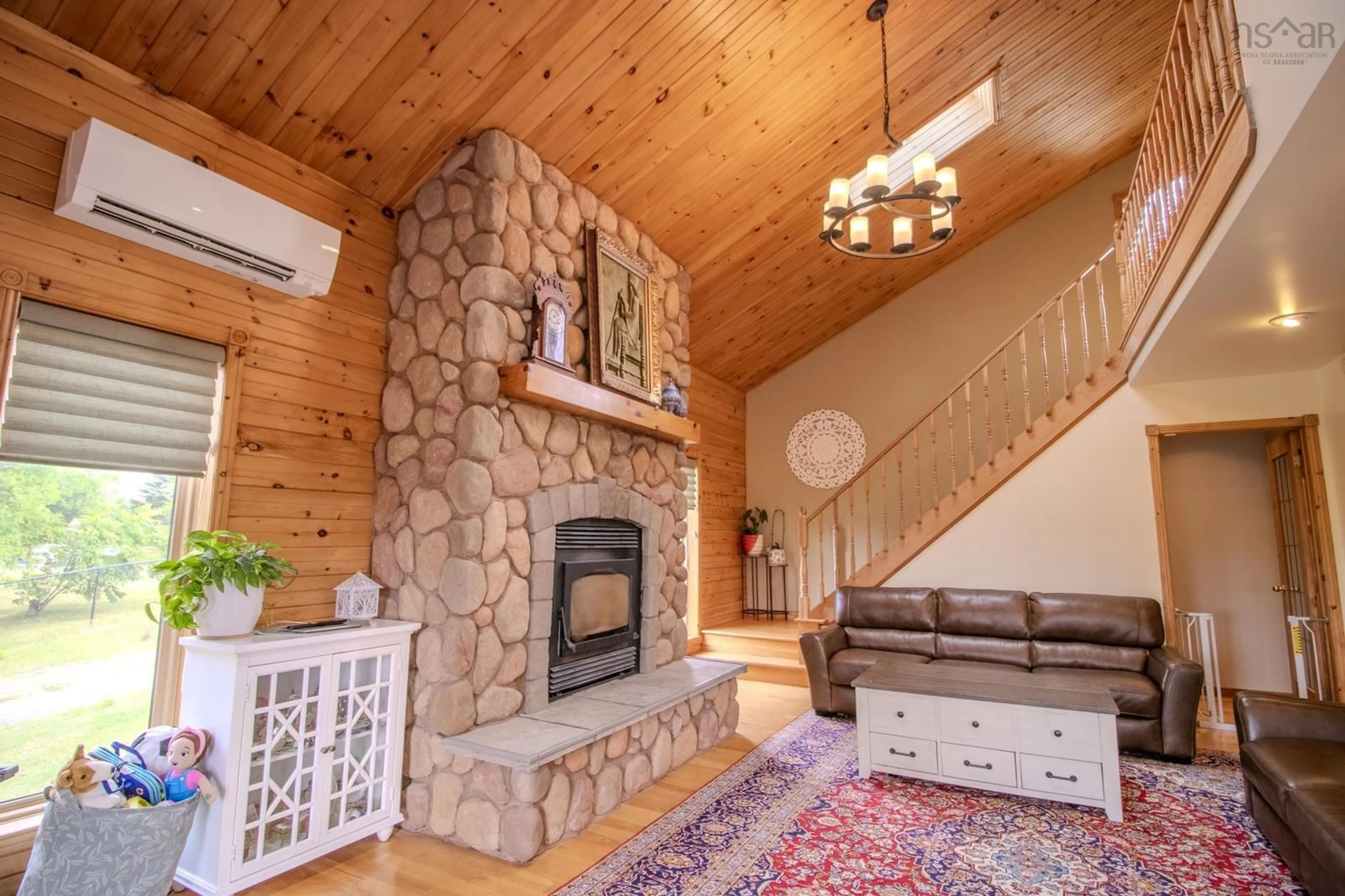 Living room with furniture, wood/laminate floor for 70 Lanceleve Cres, Albert Bridge Nova Scotia B1K 3J3