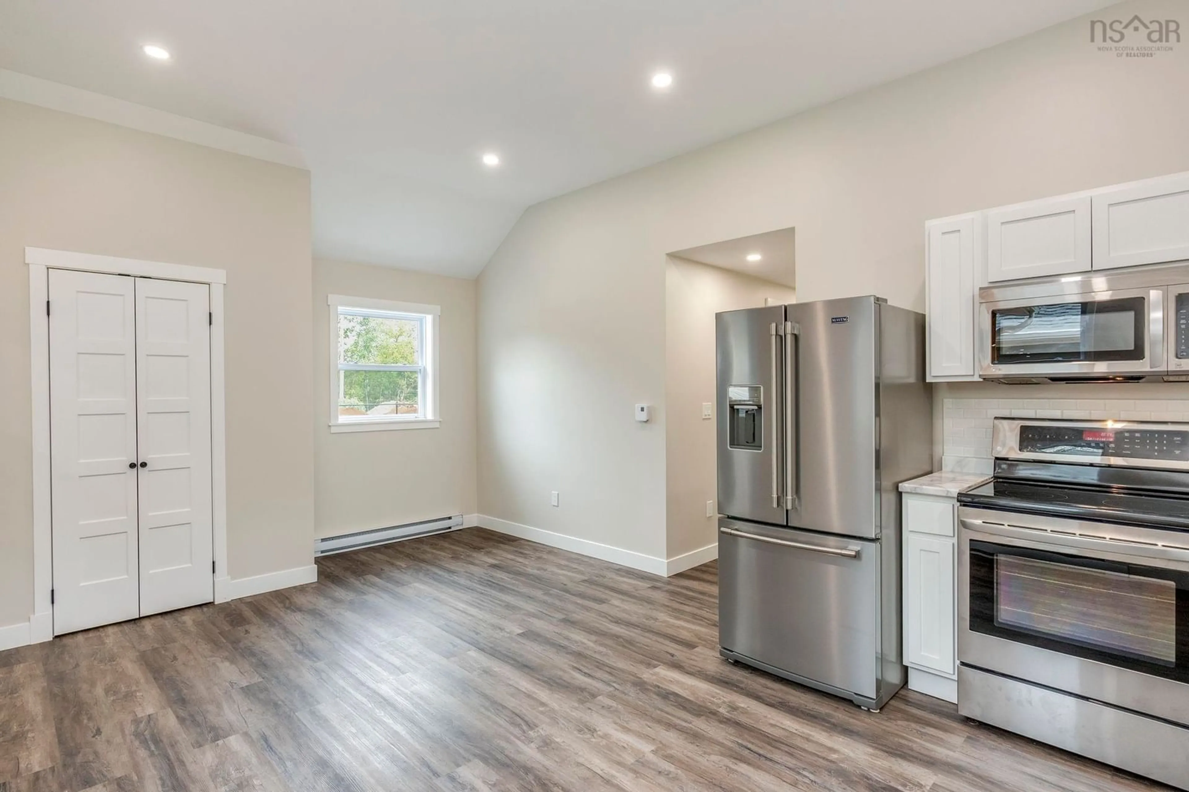 Open concept kitchen, wood/laminate floor for 829 North Bishop Rd, Lakeville Nova Scotia B4N 3V7