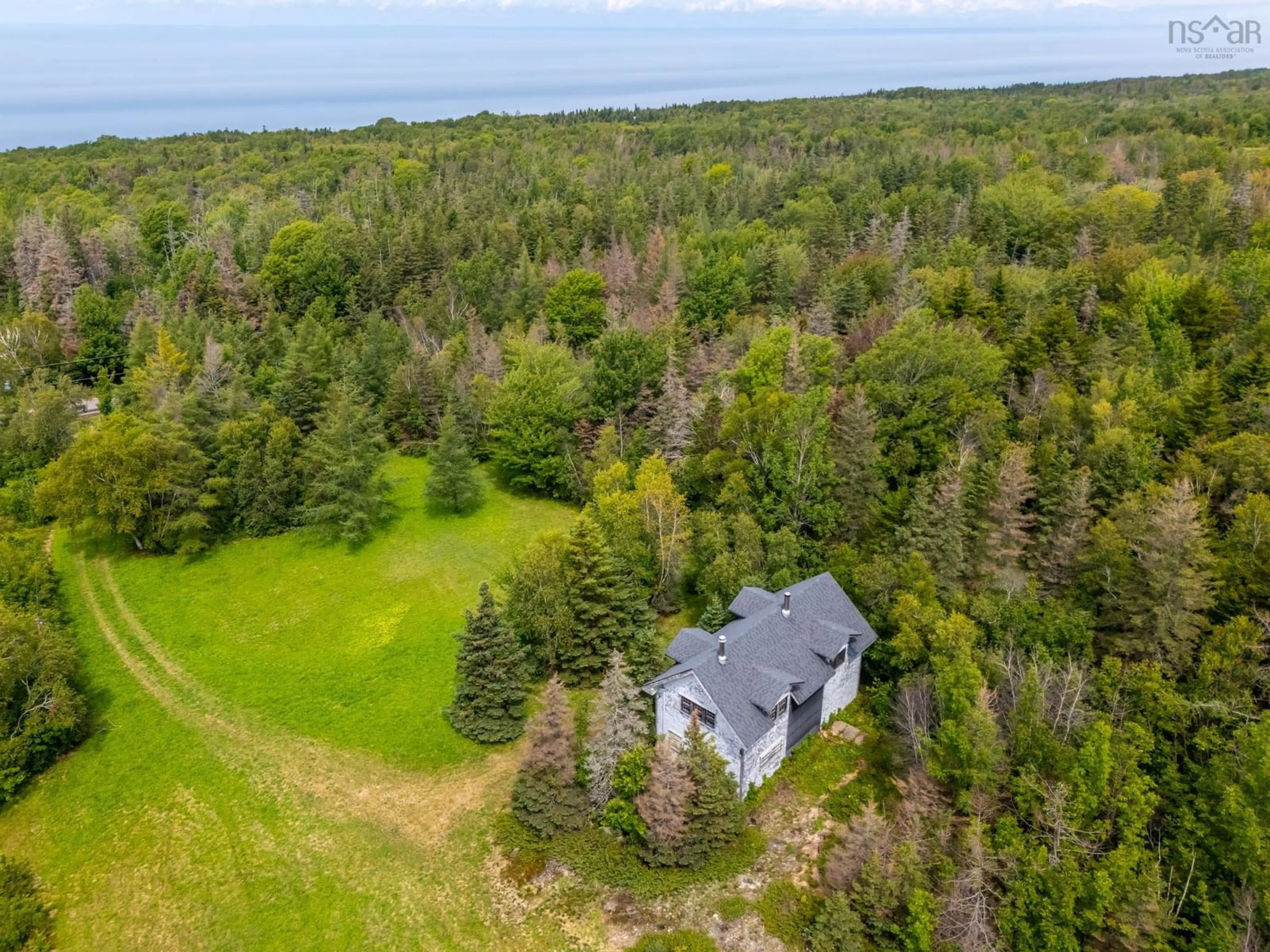 A pic from outside/outdoor area/front of a property/back of a property/a pic from drone, water/lake/river/ocean view for 7656 Shore Rd, Hampton Nova Scotia B0S 1L0