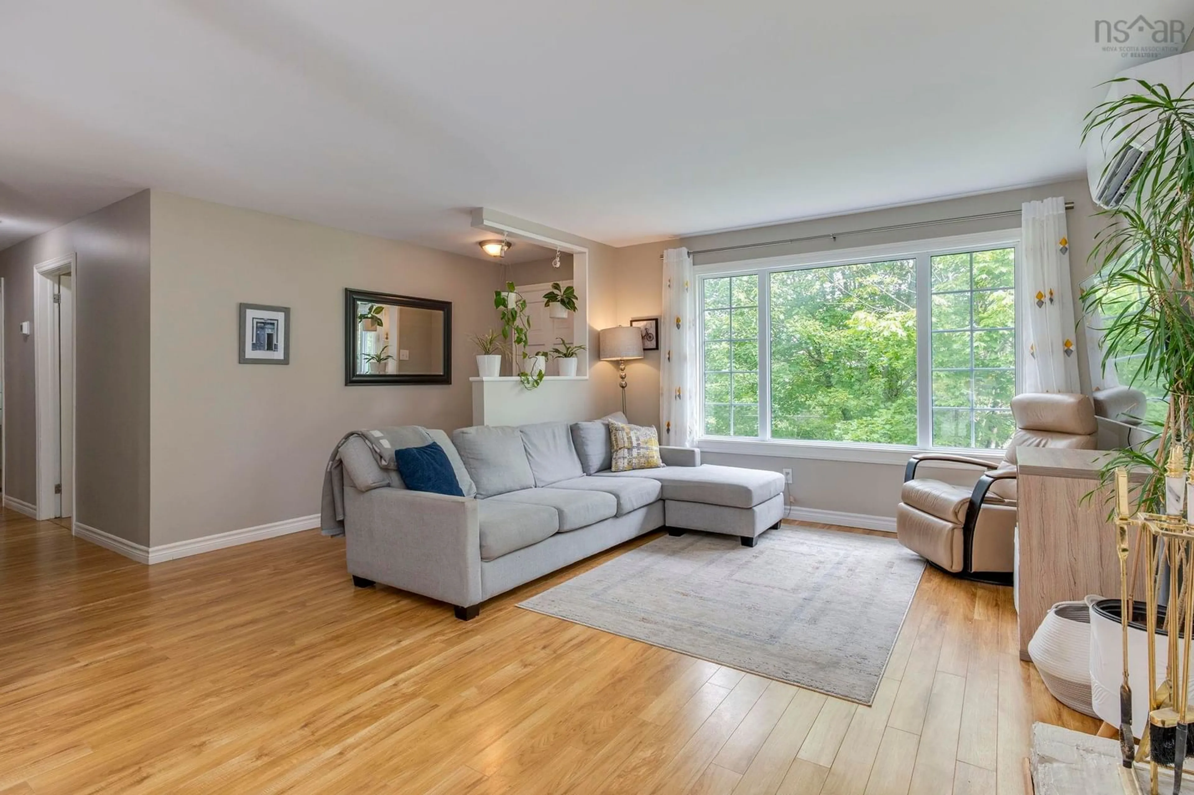 Living room with furniture, wood/laminate floor for 117 Brookside Rd, Brookside Nova Scotia B3T 1S3