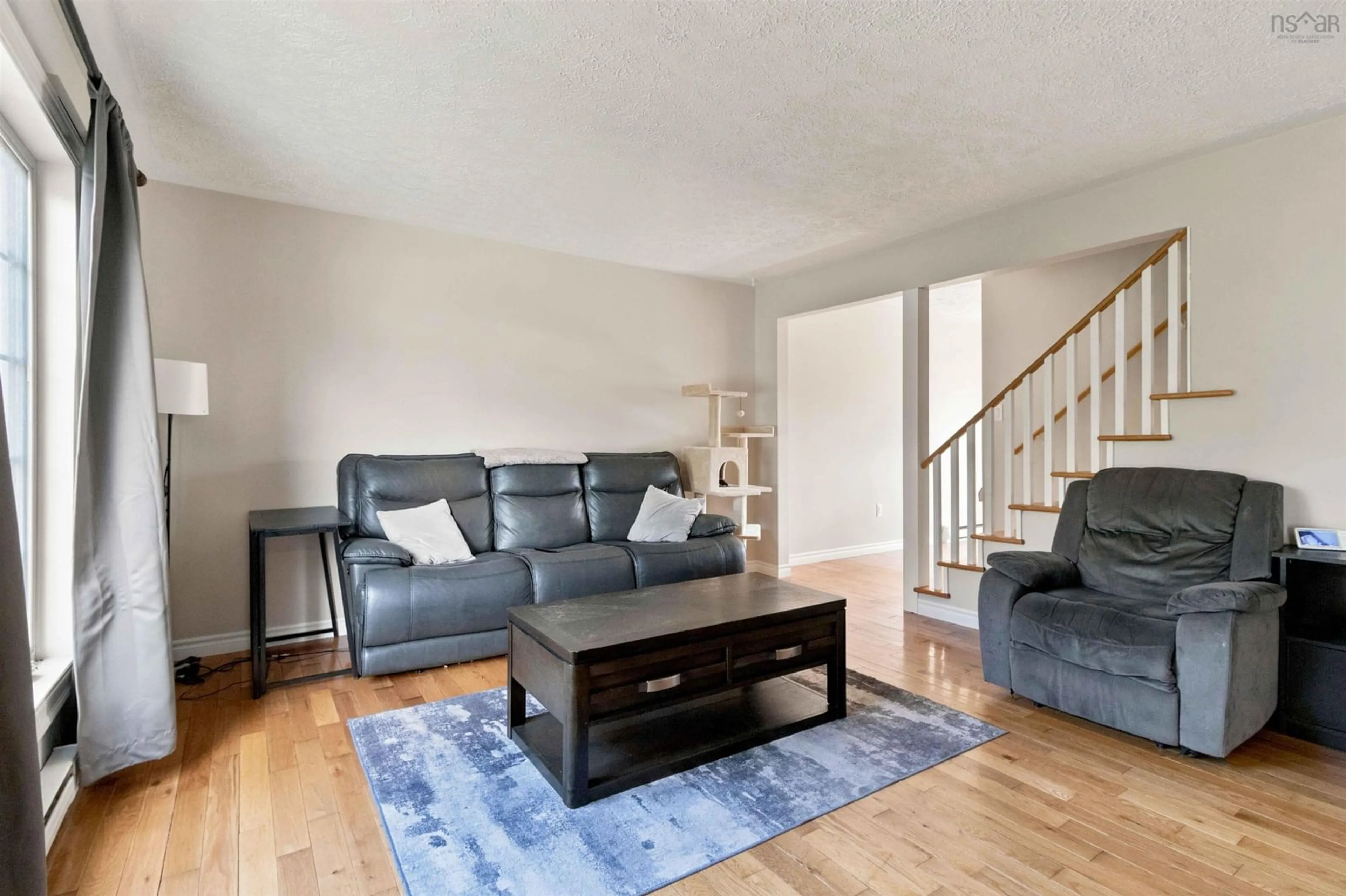 Living room with furniture, wood/laminate floor for 17 Osborne Dr, Eastern Passage Nova Scotia B3G 1H1
