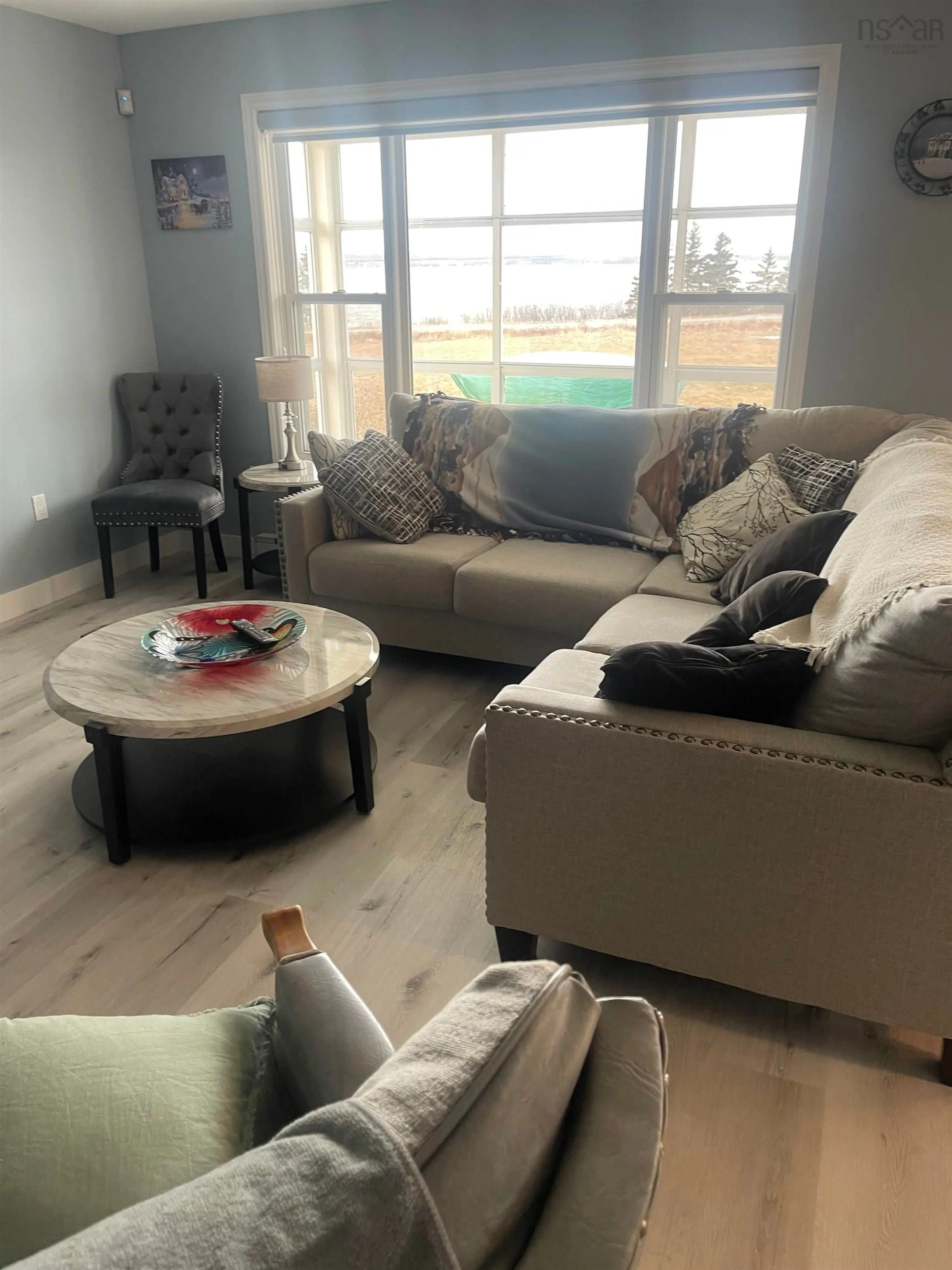 Living room with furniture, wood/laminate floor for 960 Mira Bay Dr, Catalone Gut Nova Scotia B1C 2B8