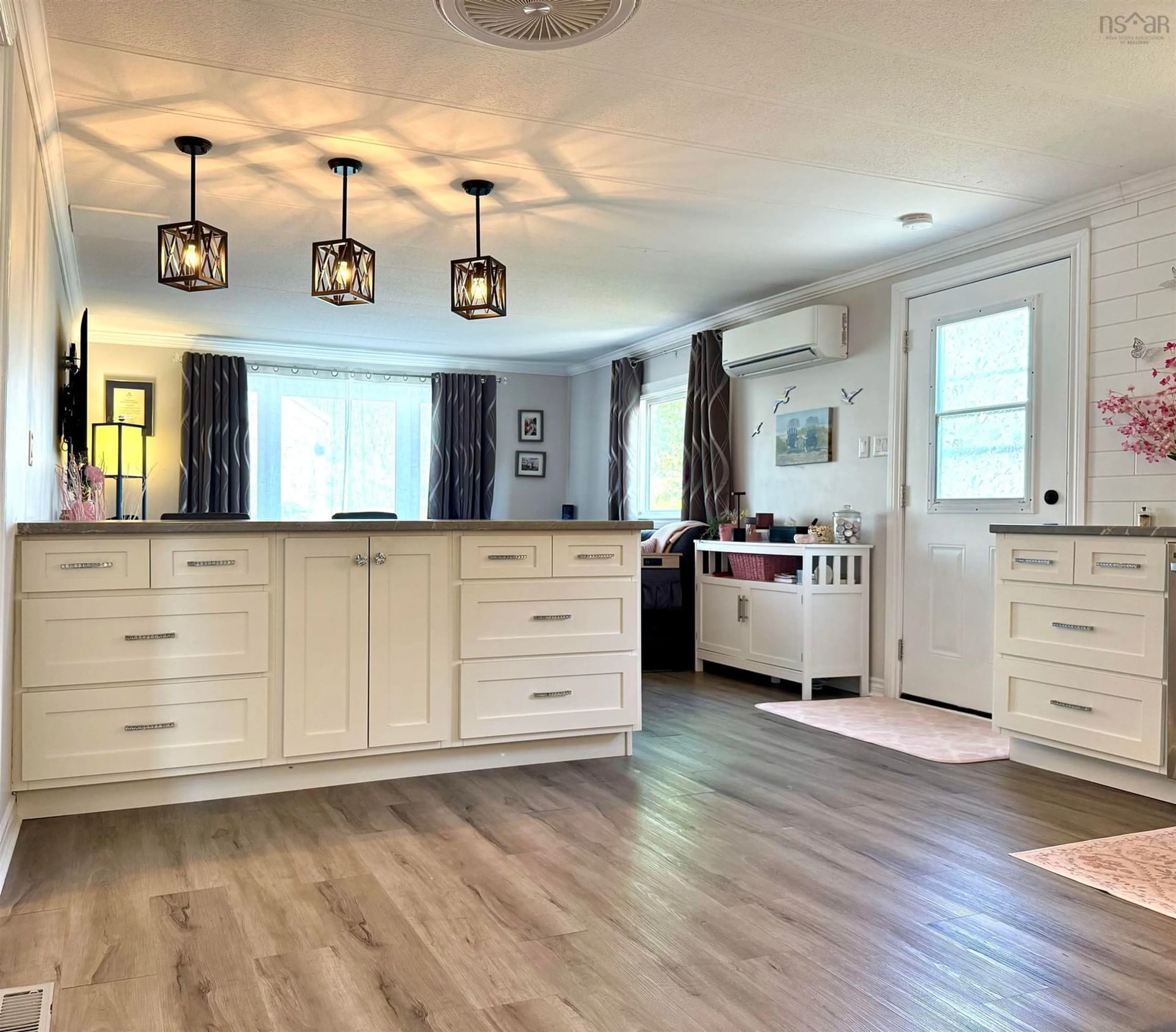 Open concept kitchen, wood/laminate floor for 67 Pleasant St, Springhill Nova Scotia B0M 1X0