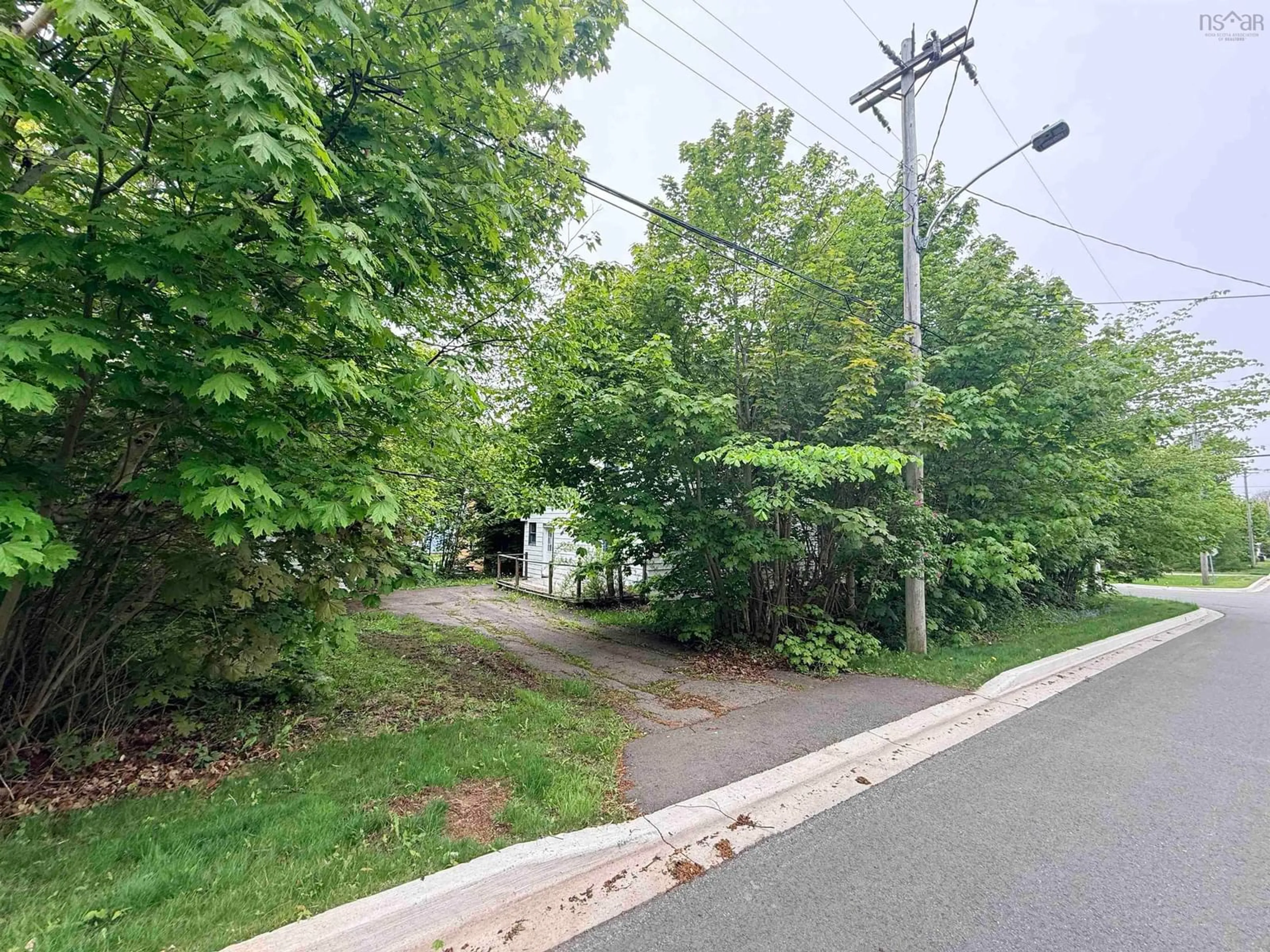 A pic from outside/outdoor area/front of a property/back of a property/a pic from drone, street for 25 Queen St, Sydney Mines Nova Scotia B1V 1L2