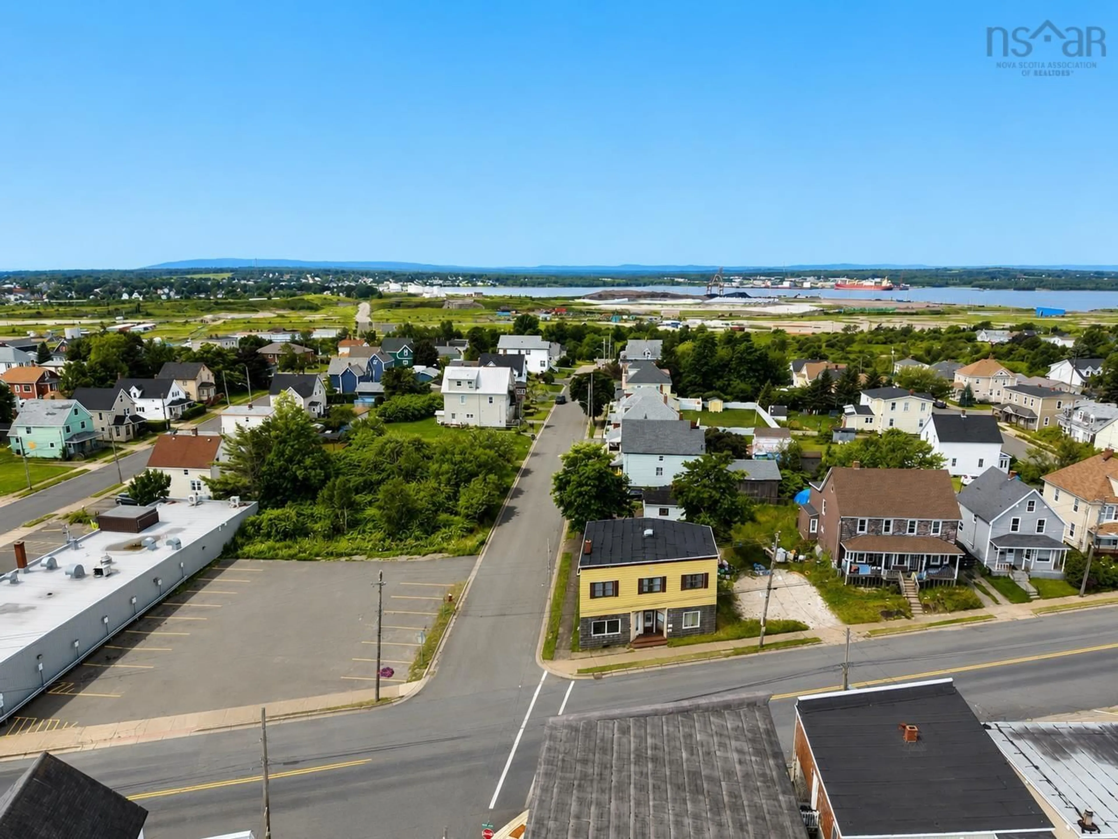 A pic from outside/outdoor area/front of a property/back of a property/a pic from drone, unknown for 757 Victoria Rd, Sydney Nova Scotia B1N 1J5
