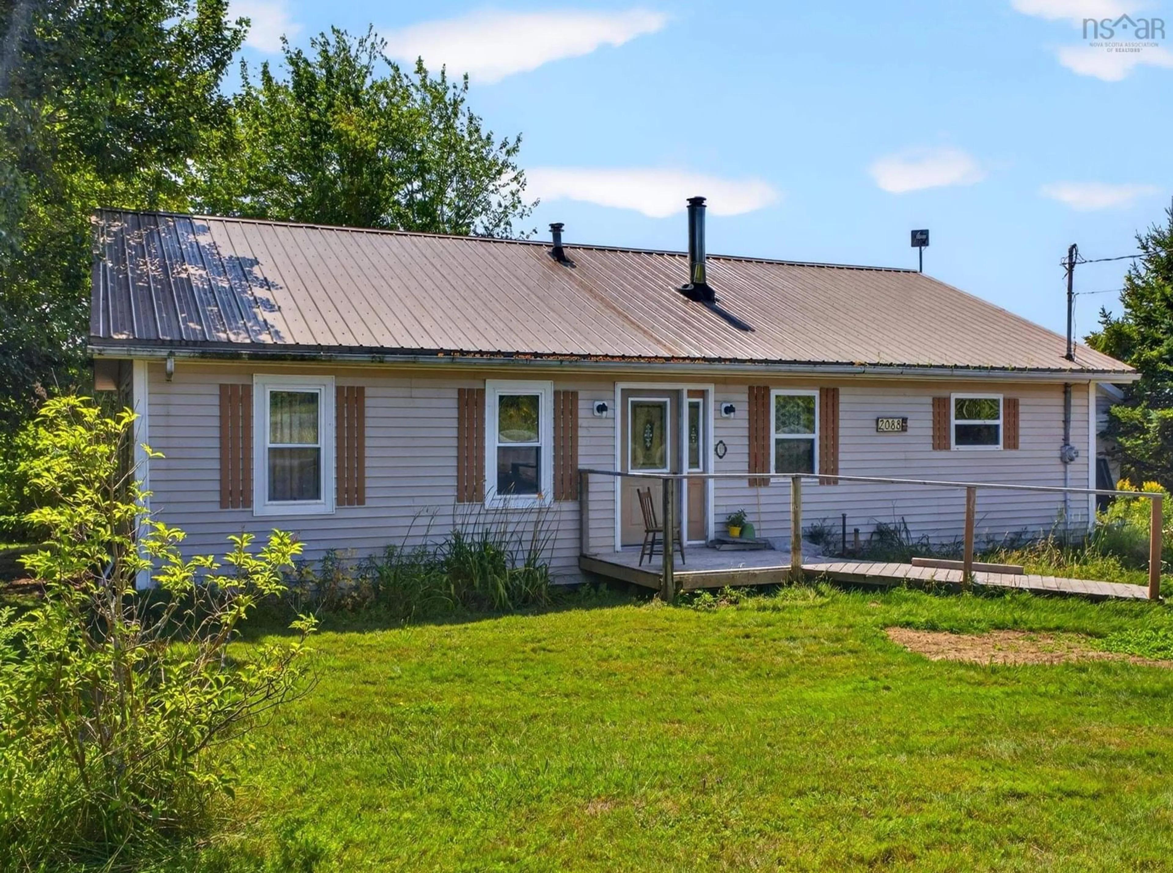 Home with vinyl exterior material, street for 2088 Malagash Rd, Upper Malagash Nova Scotia B0K 1E0