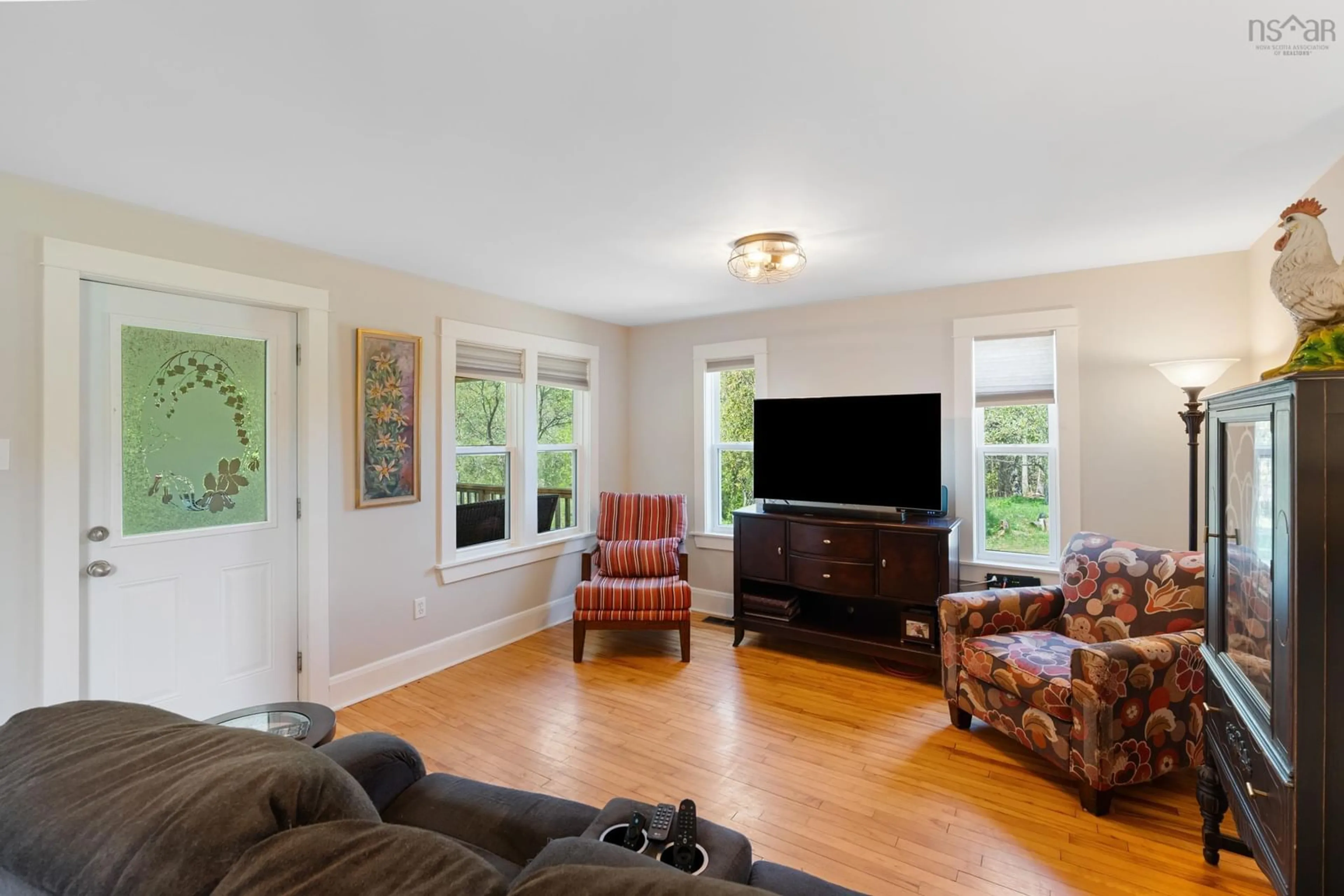 Living room with furniture, wood/laminate floor for 1313 Clementsport Rd, Clementsvale Nova Scotia B0S 1G0