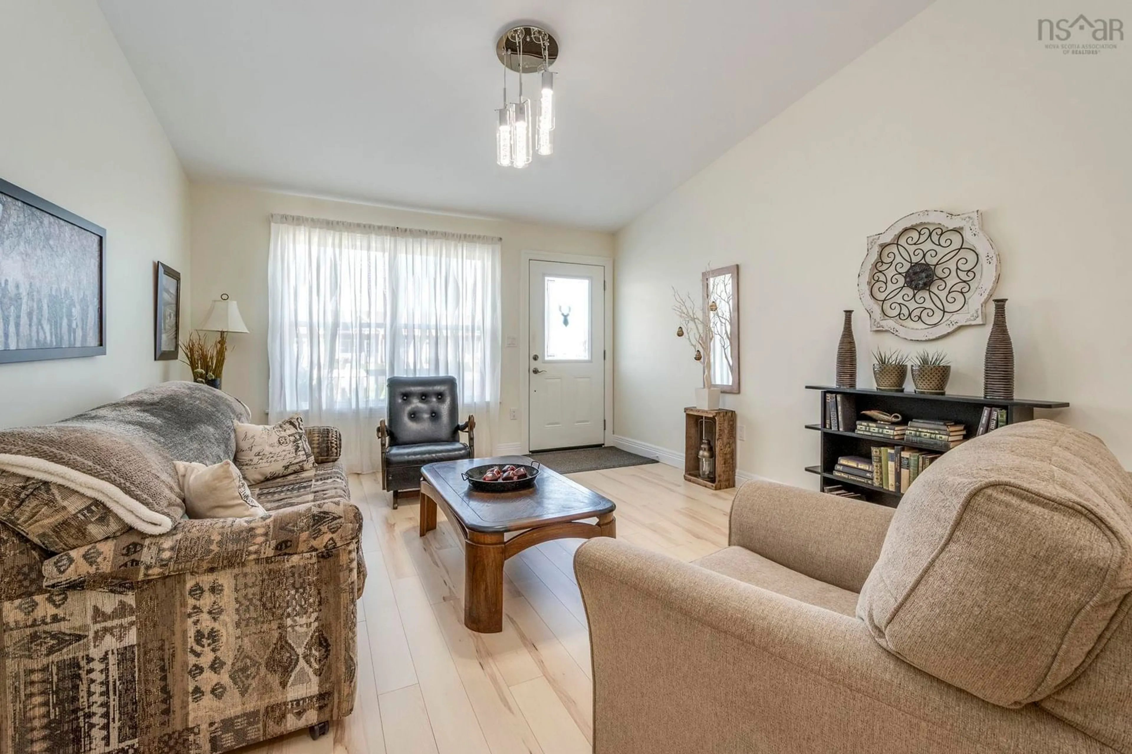 Living room with furniture, wood/laminate floor for 81 Covington Pl, Bible Hill Nova Scotia B2N 0J9