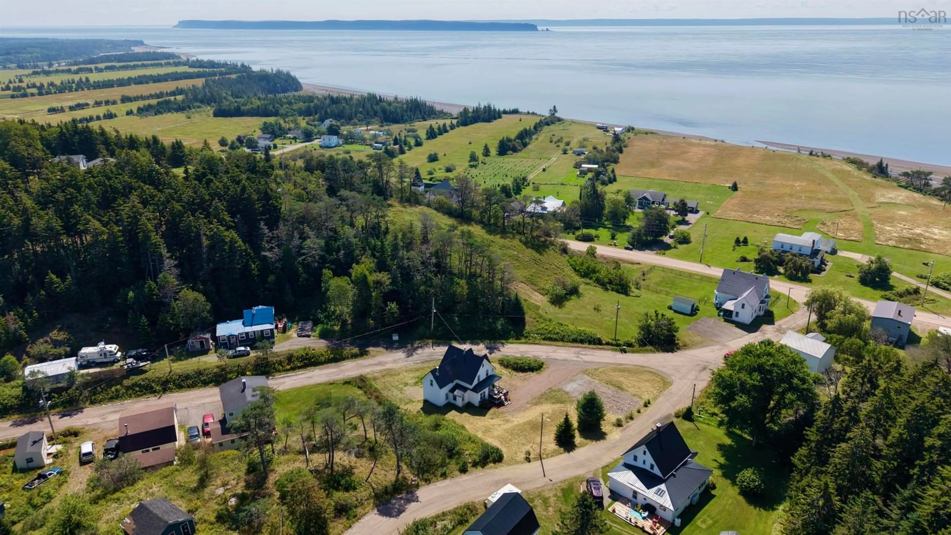 A pic from outside/outdoor area/front of a property/back of a property/a pic from drone, water/lake/river/ocean view for 212 Brook Rd, Port Greville Nova Scotia B0M 1T0