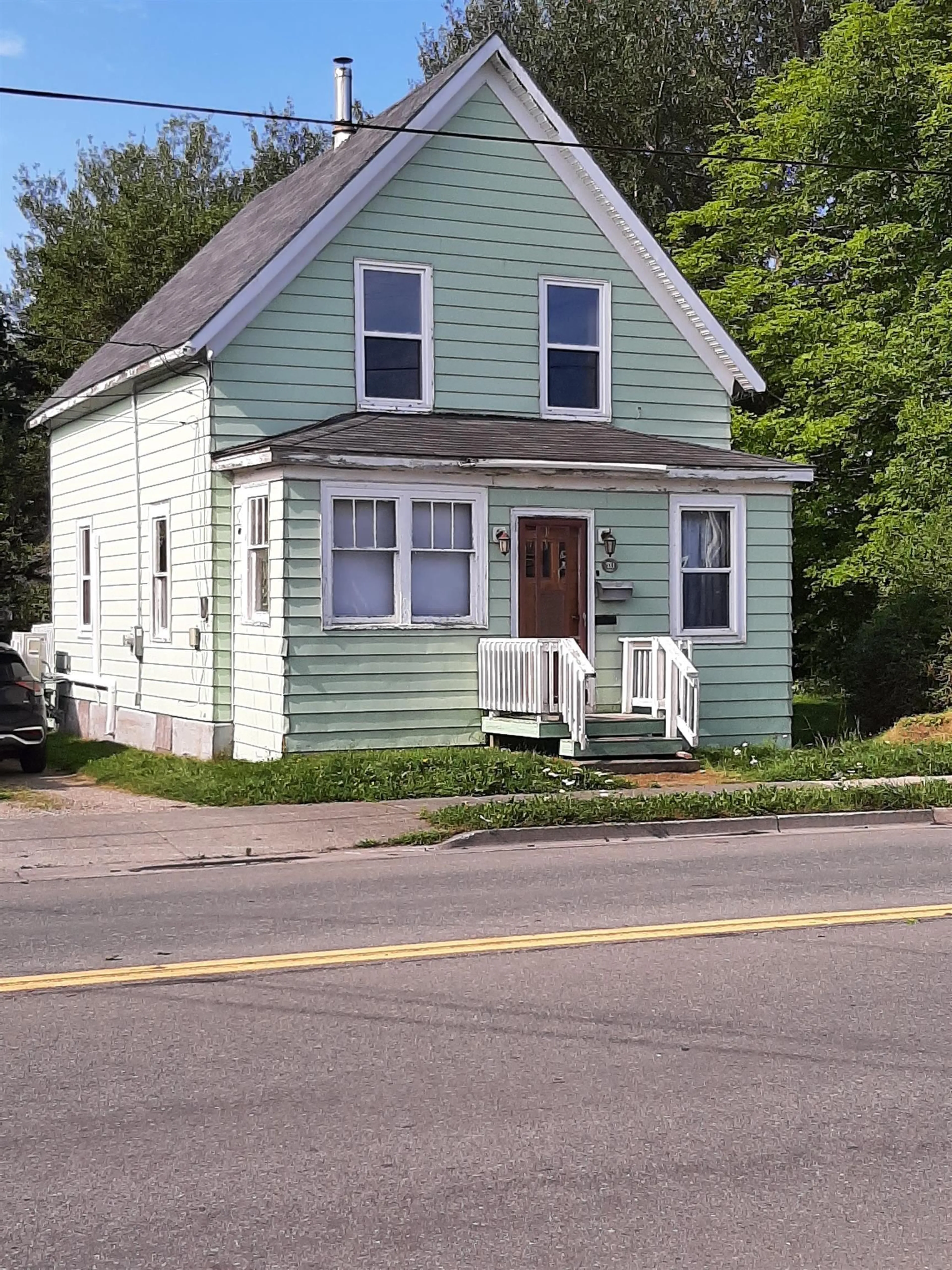 Home with vinyl exterior material, street for 70 King St, North Sydney Nova Scotia B2A 2T4